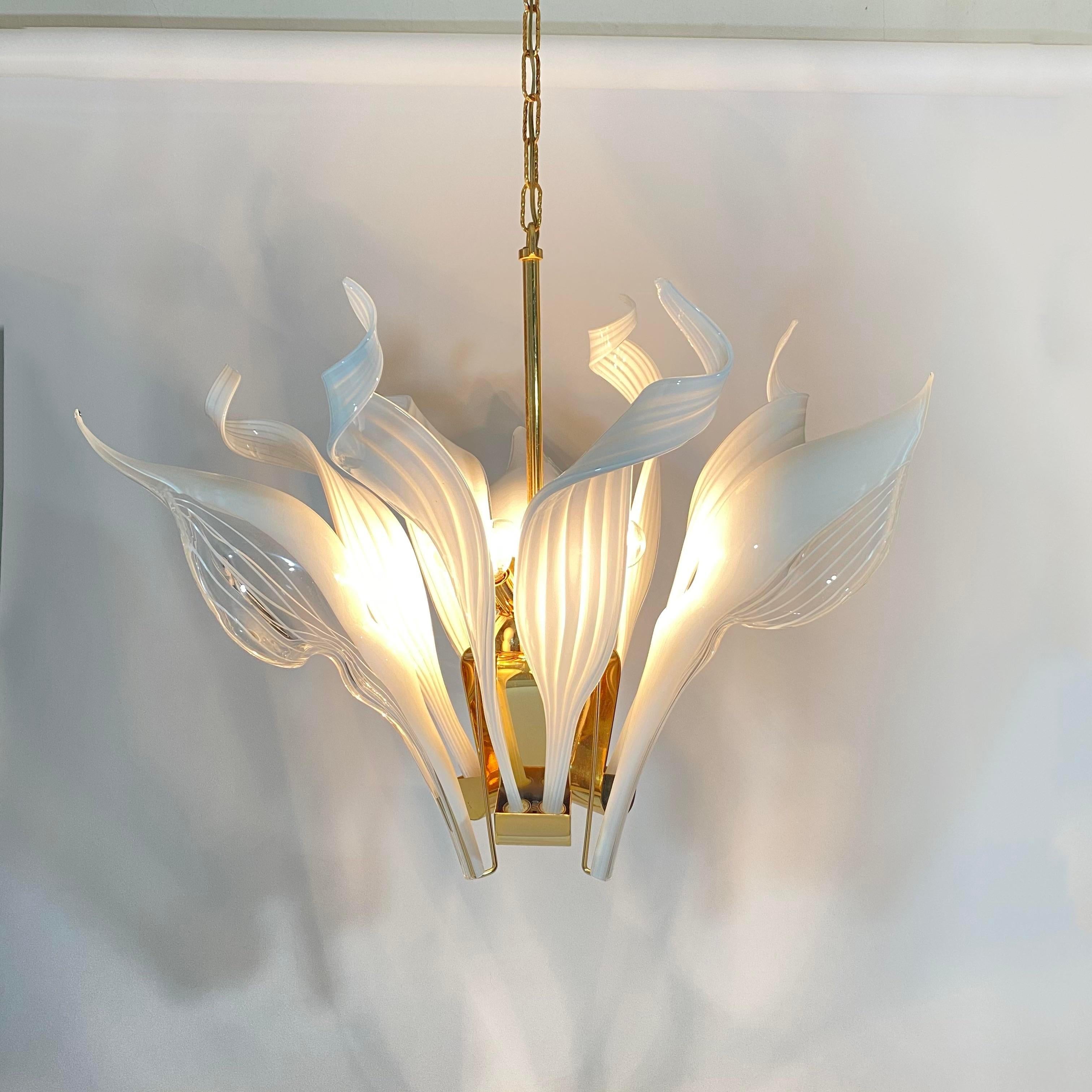 Circa 1970s Franco Luce Murano Glass calla lily and ribbon brass chandelier. 3 oversized calla lily hand blown flowers and 6 striped hand forged ribbons with stripe detail. Excellent vintage condition and a true statement piece. Chandelier is
