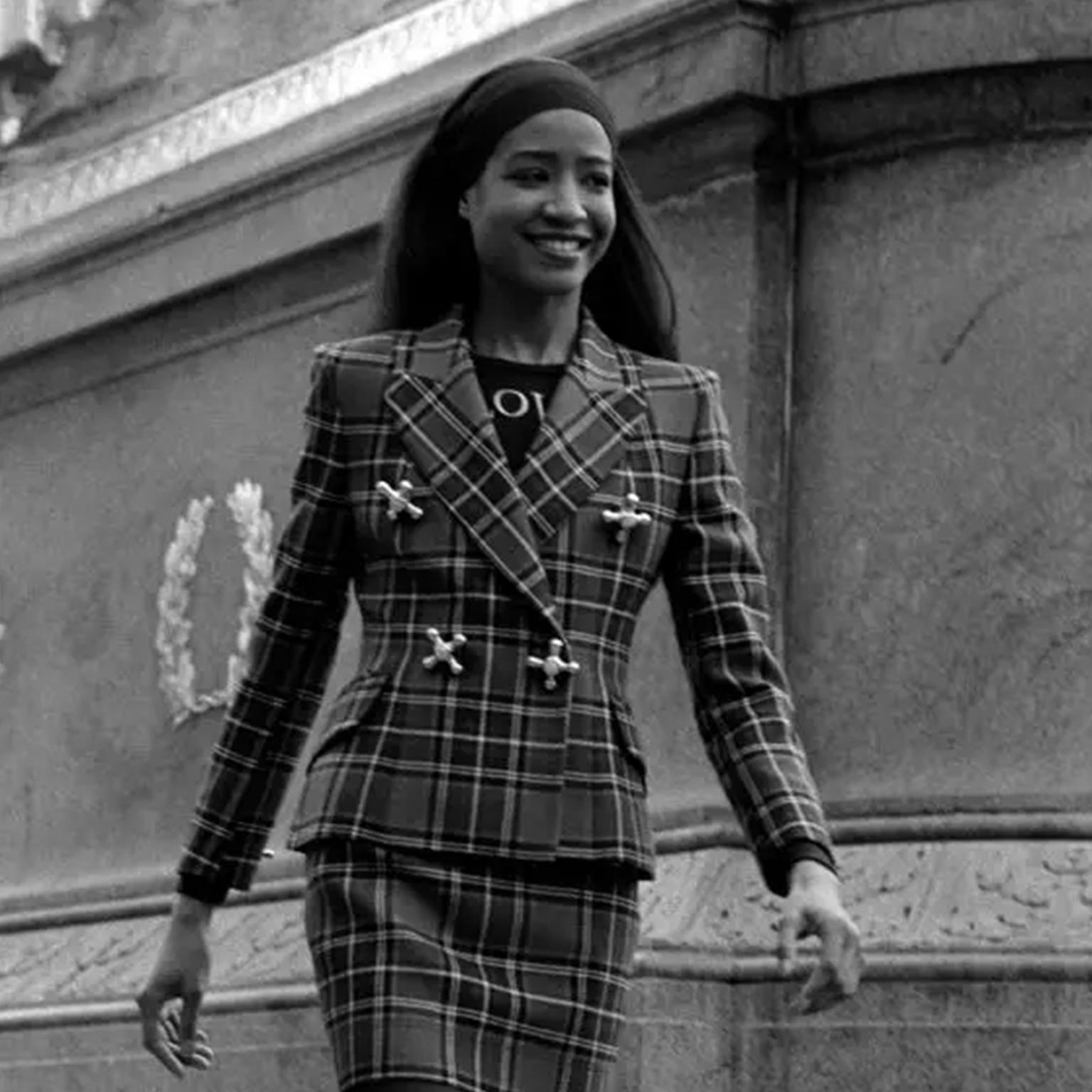 This is an iconic vintage Franco Moschino jacket with hot and cold water faucet handles on front instead of buttons! This jacket is from the Autumn Winter 1991 Moschino collection and it was shown in the advance releases in a plaid fabric - we are