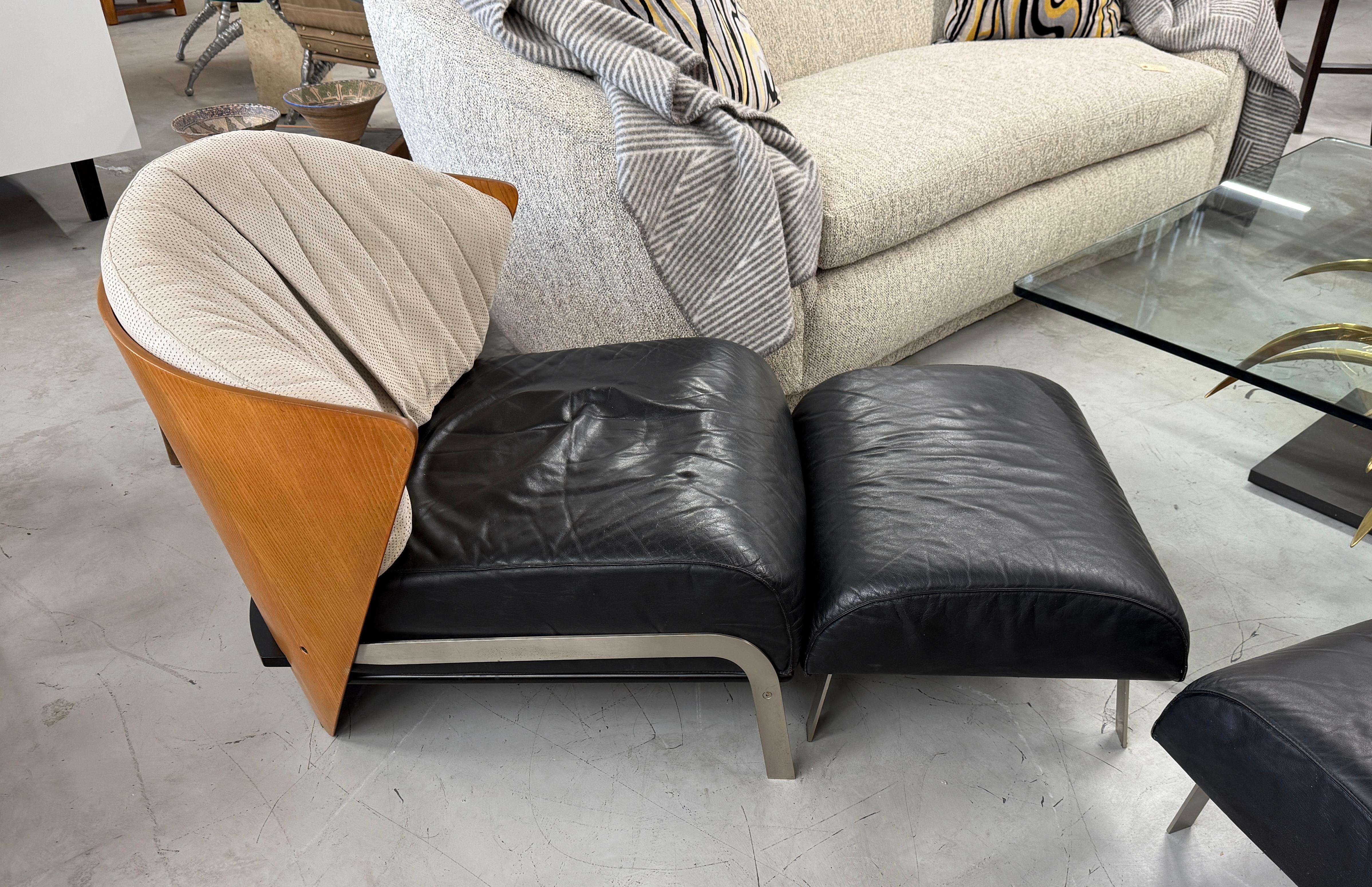 Wonderful pair of Elba chairs and ottoman by Franco Raggi for Cappellini. These were first designed in 1983 and produced in the 1980s through the late 1990's. This production is from the 1990's when they were purchased. Beautiful elegant lines with