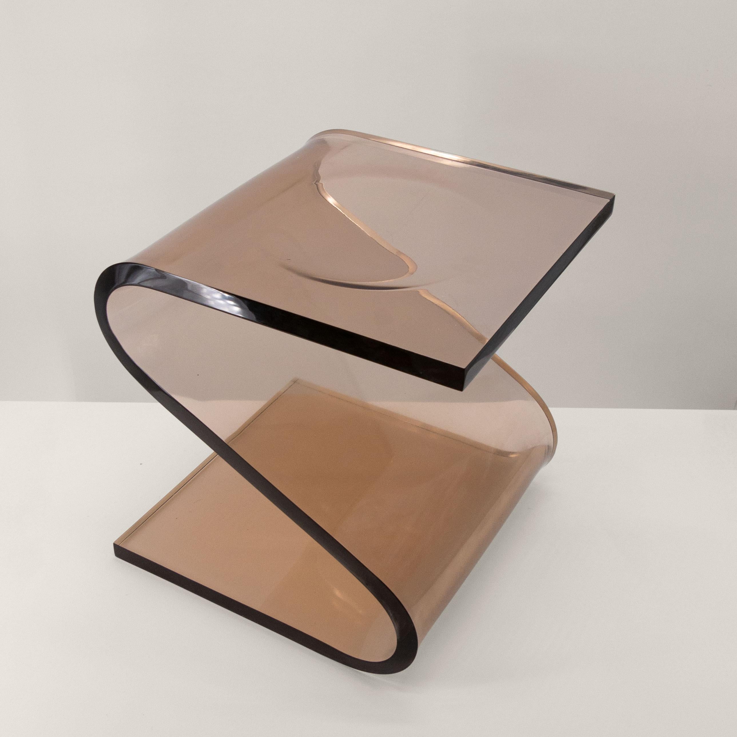 The Z Stool by François Arnal was created in 1970, it is made of folded smoked polymethylmethacrylate. This material, more commonly known as Plexiglas, allows the creation of lines of great fluidity while maintaining sufficient rigidity to serve as
