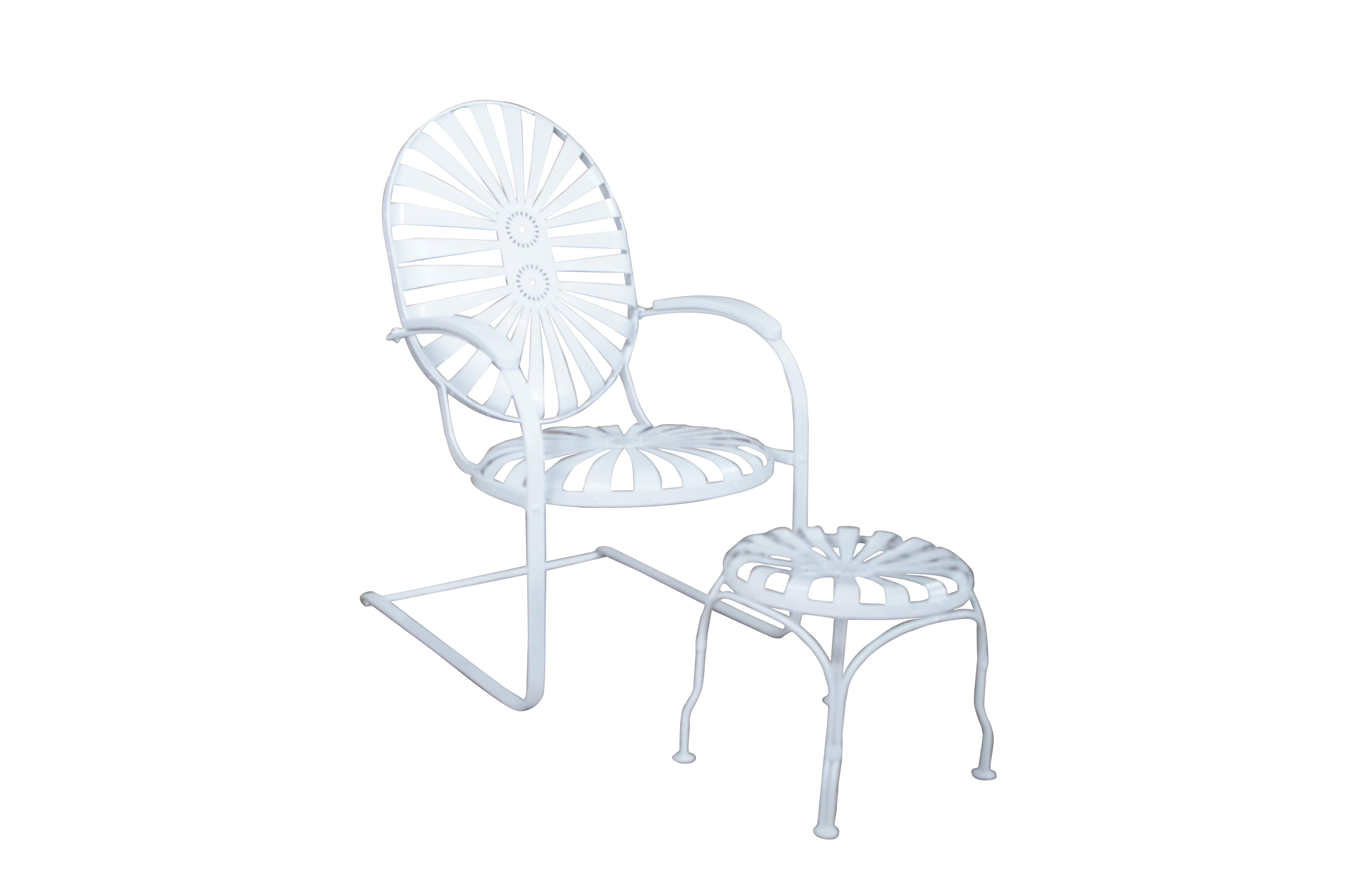 Beautiful Francois Carré Art Deco cantilever spring arm chair and footstool, circa 1930s.  Features a sunburst design over cantilever base.  Finished in white.  

Dimensions:
32