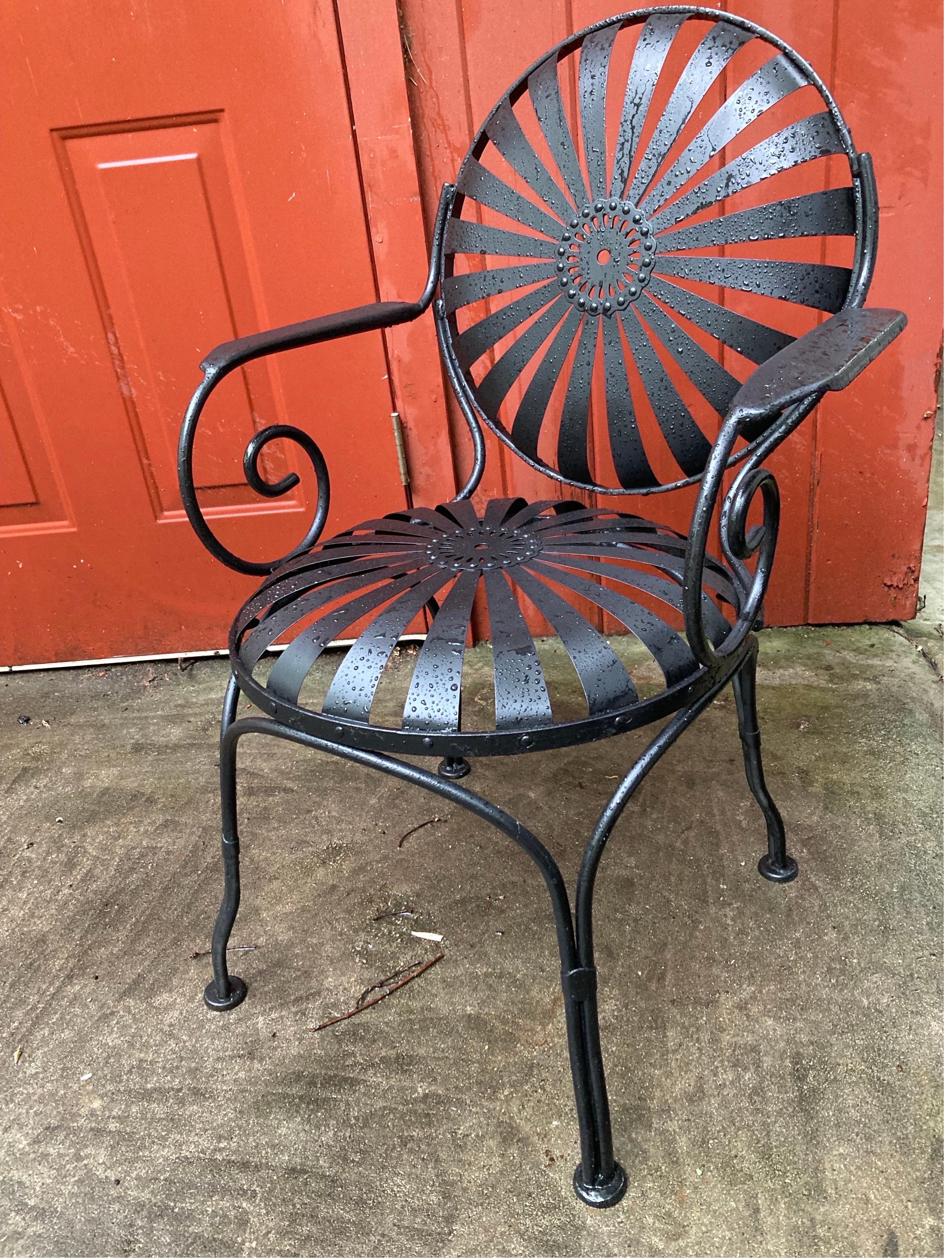 beautifully redone pair of garden chairs, sandblasted primed and painted in satin black,
no maker’s mark… 
these would work indoors or outside
can withstand heat and direct sun