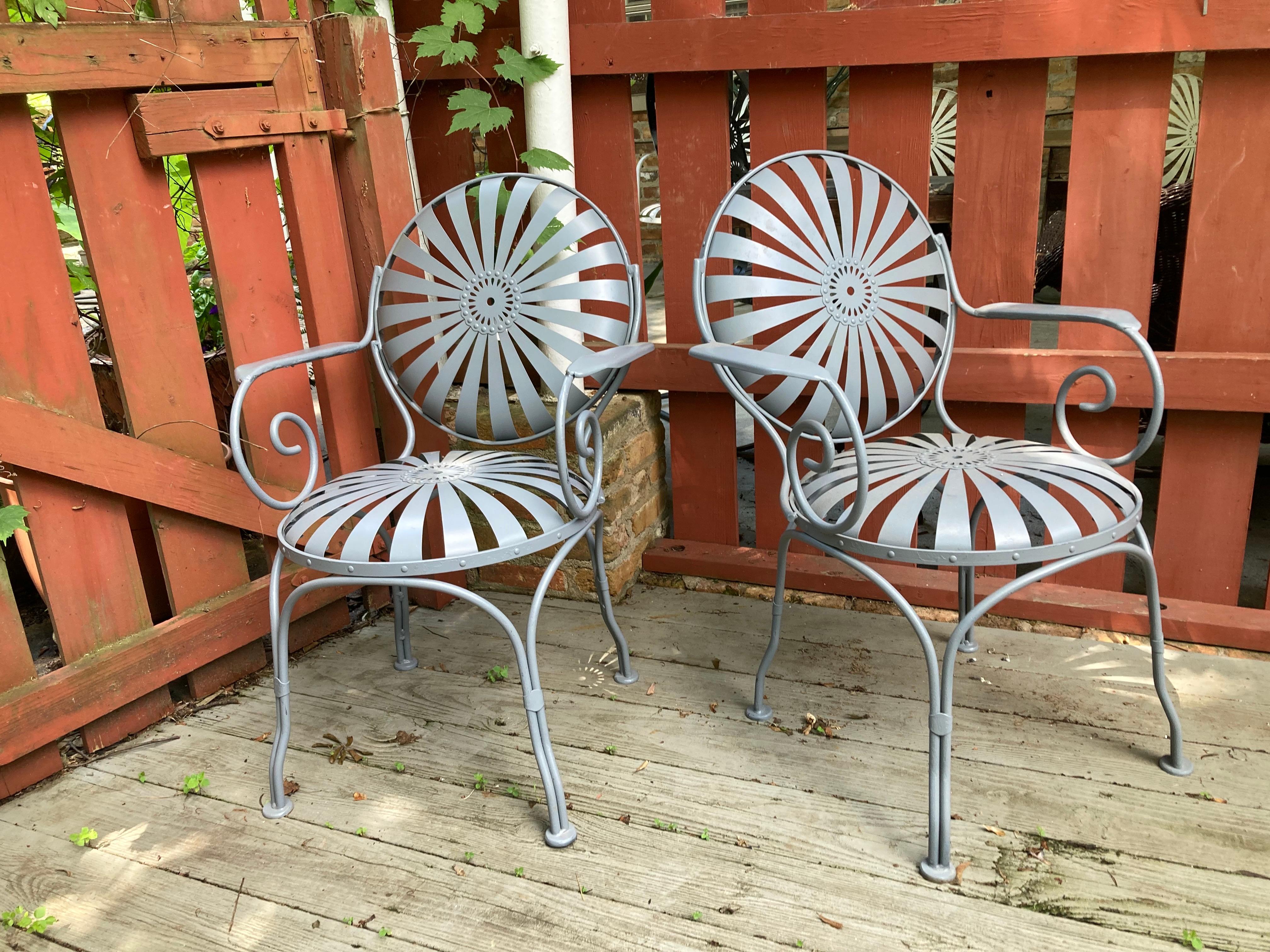 beautifully redone pair of garden chairs, sandblasted primed and painted in oyster gray,
no maker’s mark… 
these would work indoors or outside
can withstand heat and direct sun