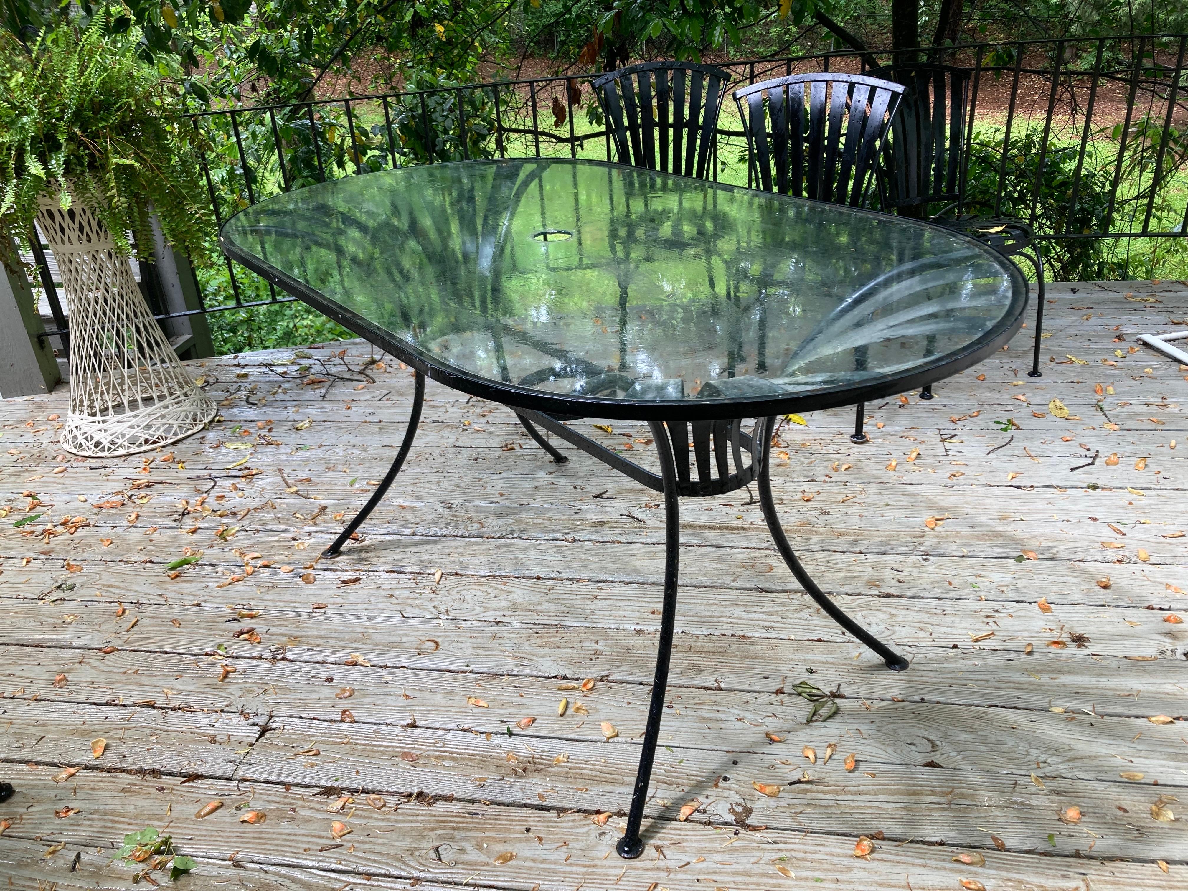 in near mint condition, lived most of their lives in a carolina coastal home on a screened in porch.

table is 60 wide, 33.5 deep and 30 tall

glass has umbrella hole, client can purchase protective ring at any patio store based on the size of your