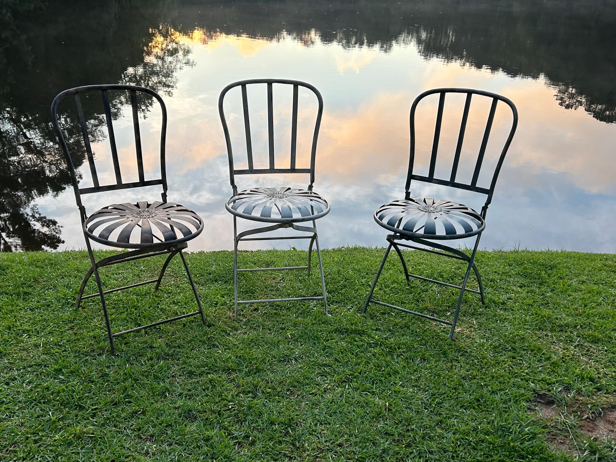 Incredible set of 3 Francois Carre folding chairs! These beauties are in excellent sitting/working condition and will grace any area. The folding mechanisms are all extremely smooth and the workmanship is fabulous. One in cream, one in grey, and one