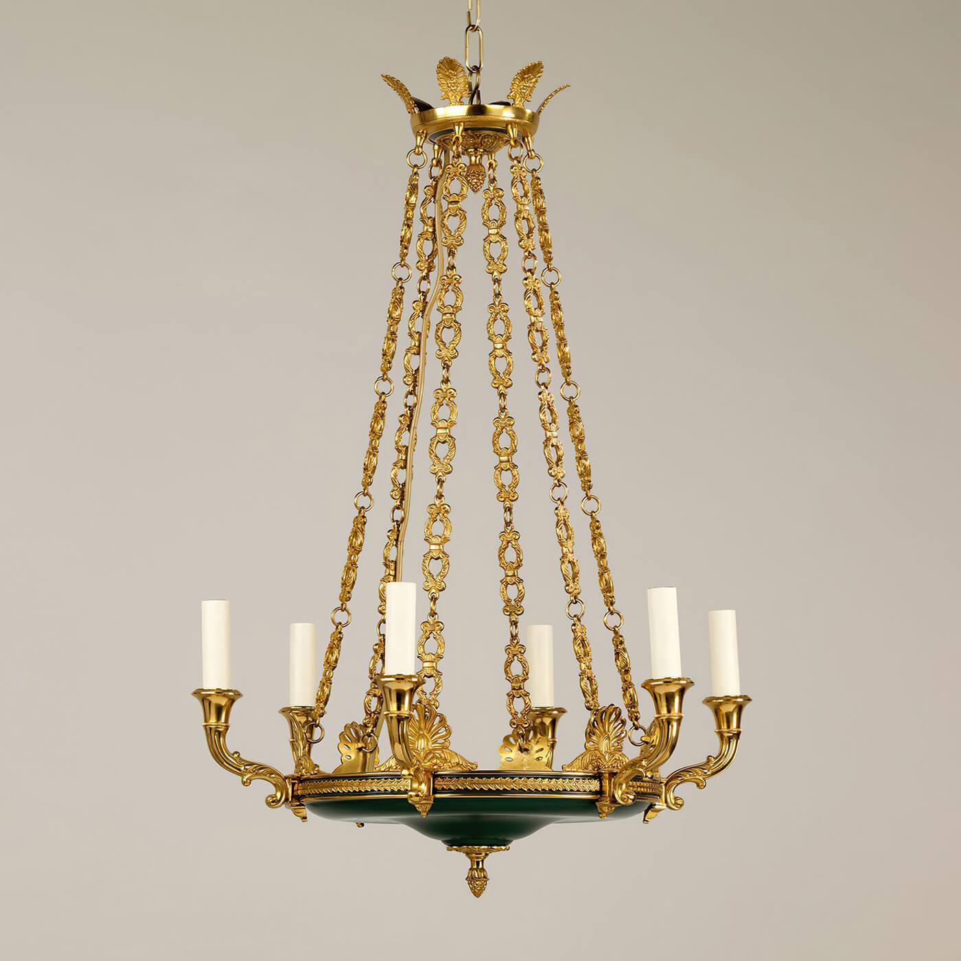 Francois Empire six-light chandelier, the ornate decoration on the arms, and the arrangement of the chains demonstrate exceptional casting in brass. With beautifully cast floral details of acanthus and palmettes, with acorn finials and a green