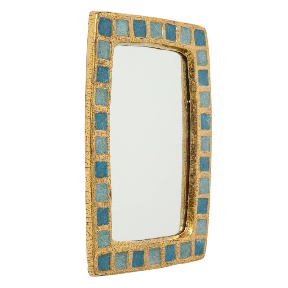 Mithé Espelt mirror, ceramic, gold and blue fused glass. Medium scale rectangular mirror with gold crackle glazed frame and blue fused glass squares. Felt covered back.