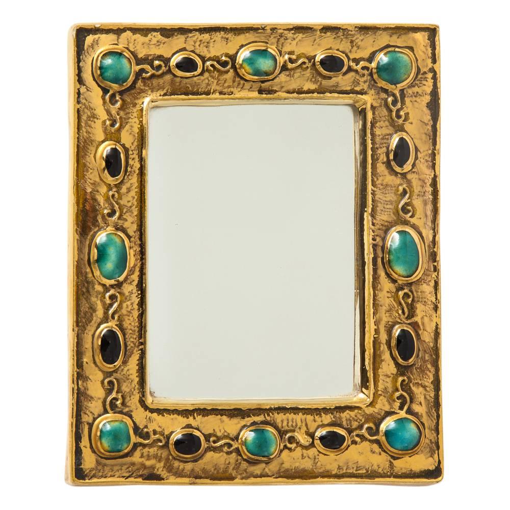 Francois Lembo mirror, ceramic, jeweled, jade, gold, and black, signed. Small scale gold glazed mirror with embedded jewel decorations. Signed: F. Lembo with incised signature.

A native of Vallauris François Lembo started his pottery career in 1951