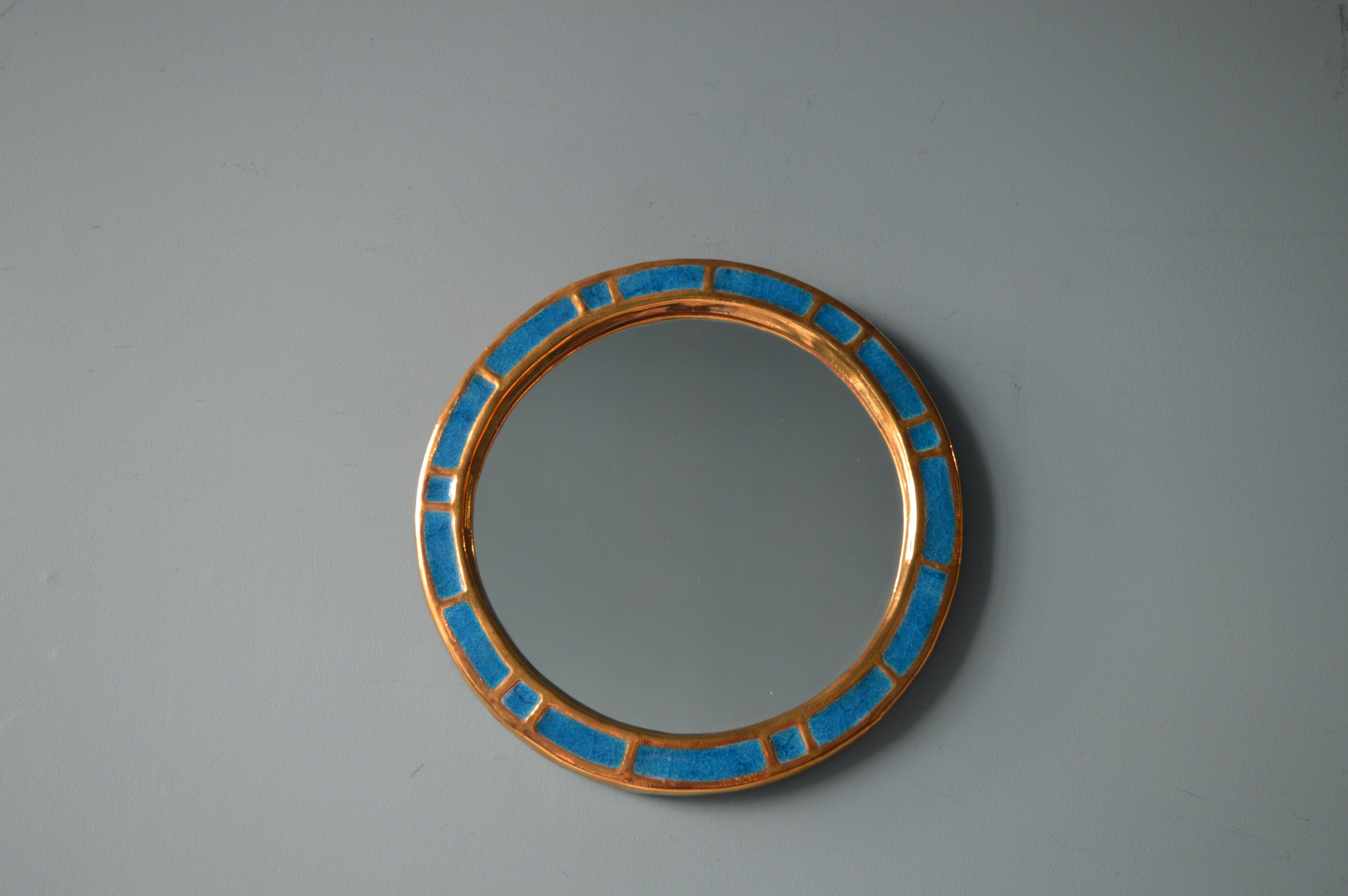 Mirror by Mithé Espelt.
Ceramic, gold an blue fused glass.
French work, circa 1960.