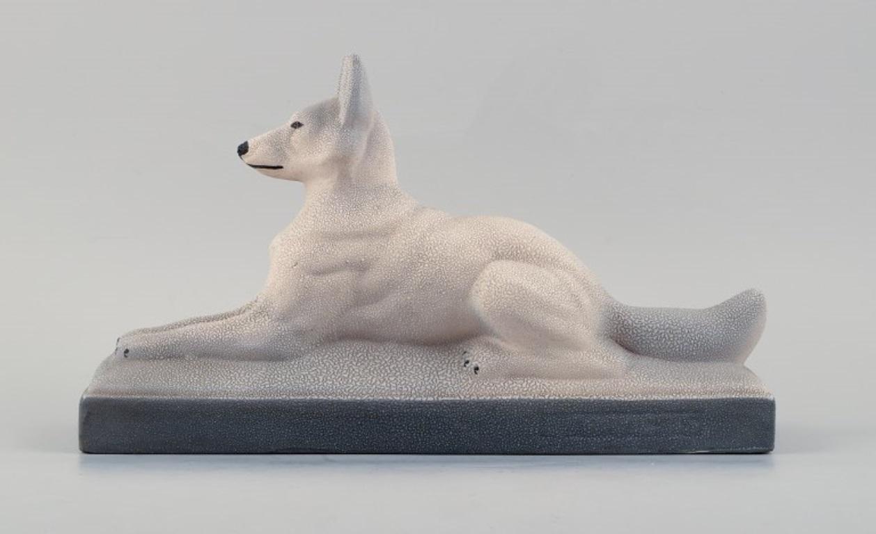 Francois Levallois (1882-1965).
Reclining dog in ceramics.
Art Deco style, 1940s.
Marked
In good condition - minor scratch on the plinth.
Dimensions: L 39.5 x H 23.0 cm.