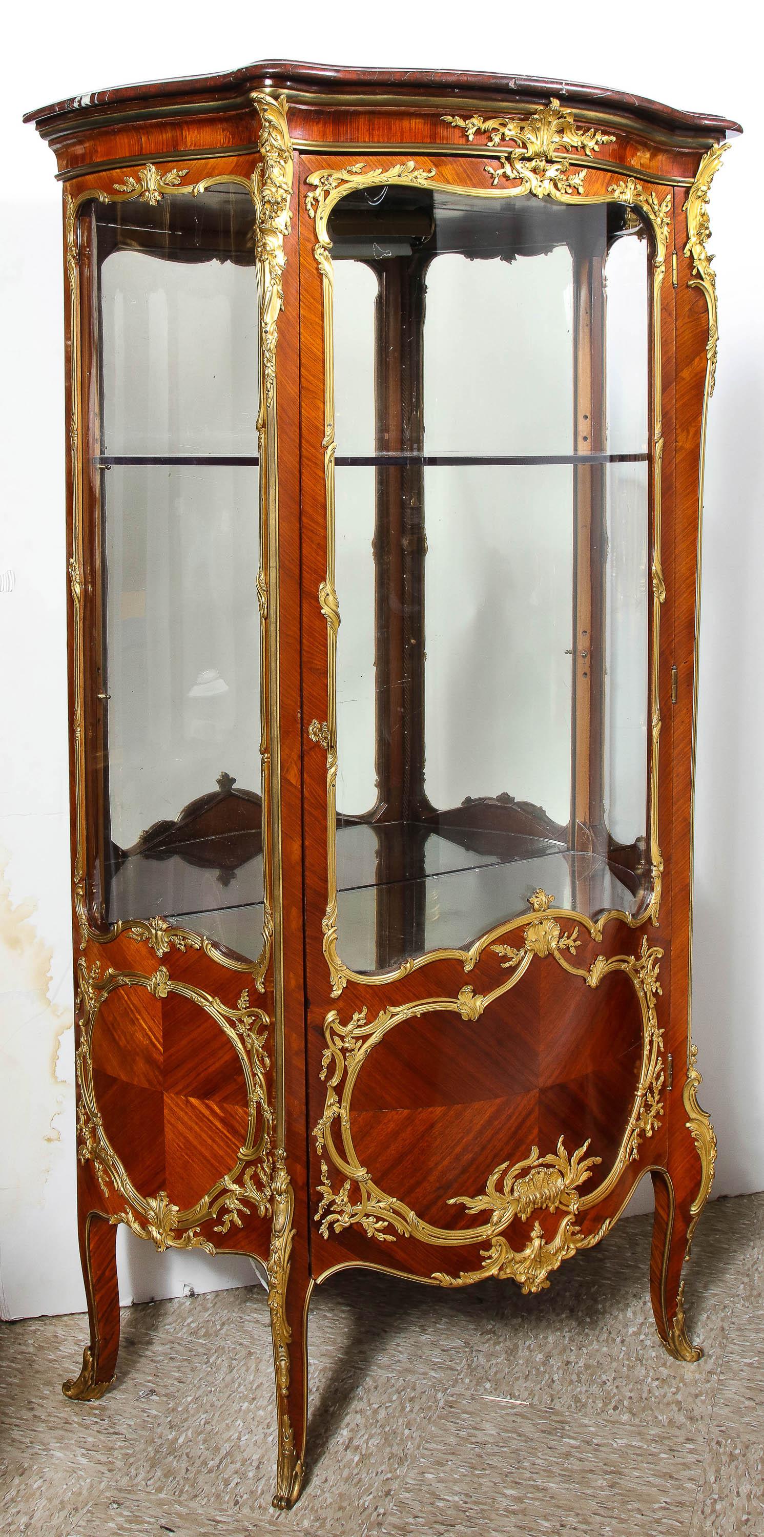 Francois Linke, an exceptional French ormolu-mounted Kingwood vitrine cabinet, circa 1880.

Signed Linke to the left bronze chute mount. 100% authentic.

Very fine quality bronze scroll mounts and with the famous Linke crab mounts to the door,