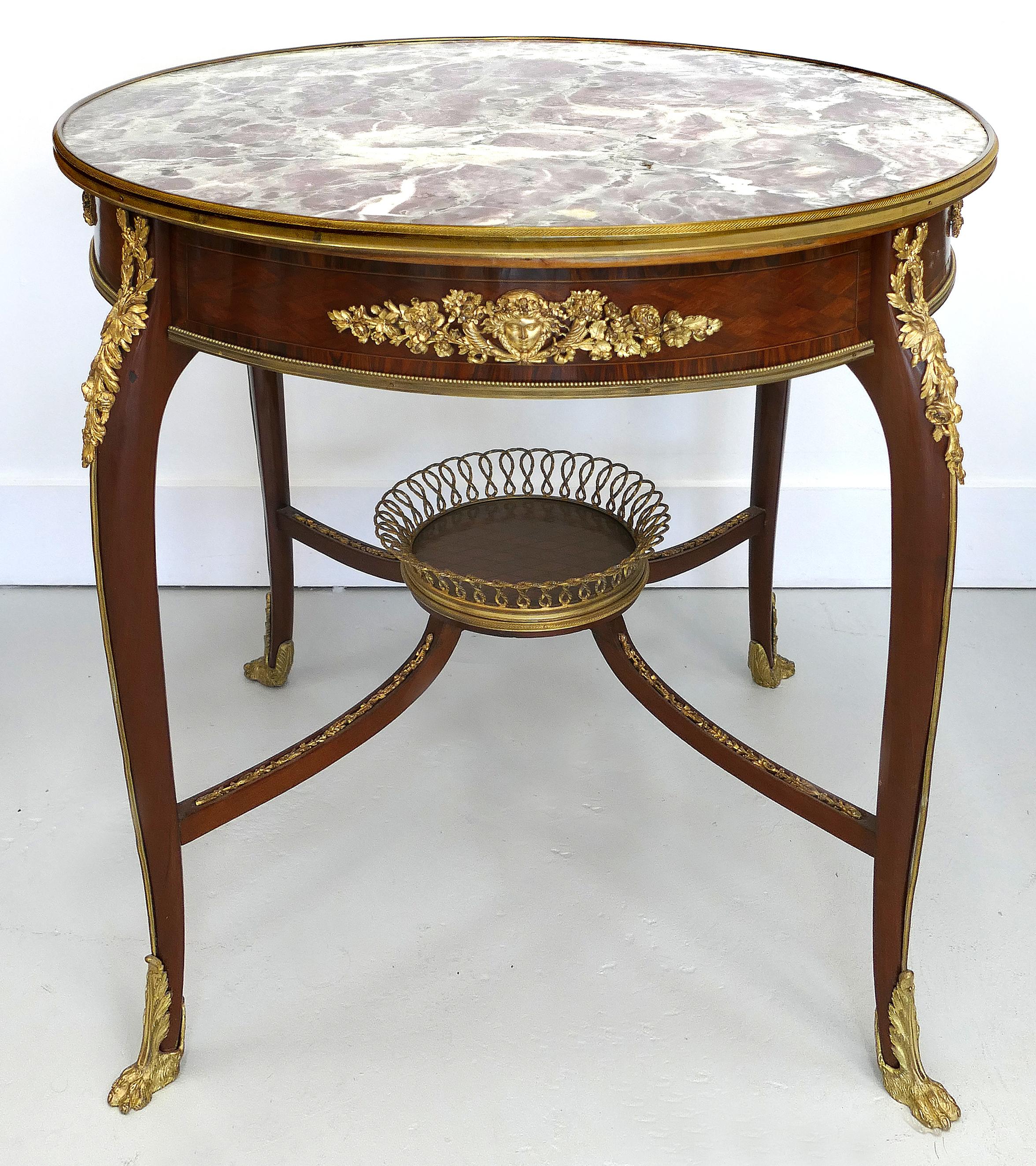 Francois Linke center table with bronze basket and mounts, France circa 1880

Offered for sale is a Francois Linke (1855-1846) Louis XV style center table from France, circa 1880.
The late 19th century table is mounted with ornate gilt bronze