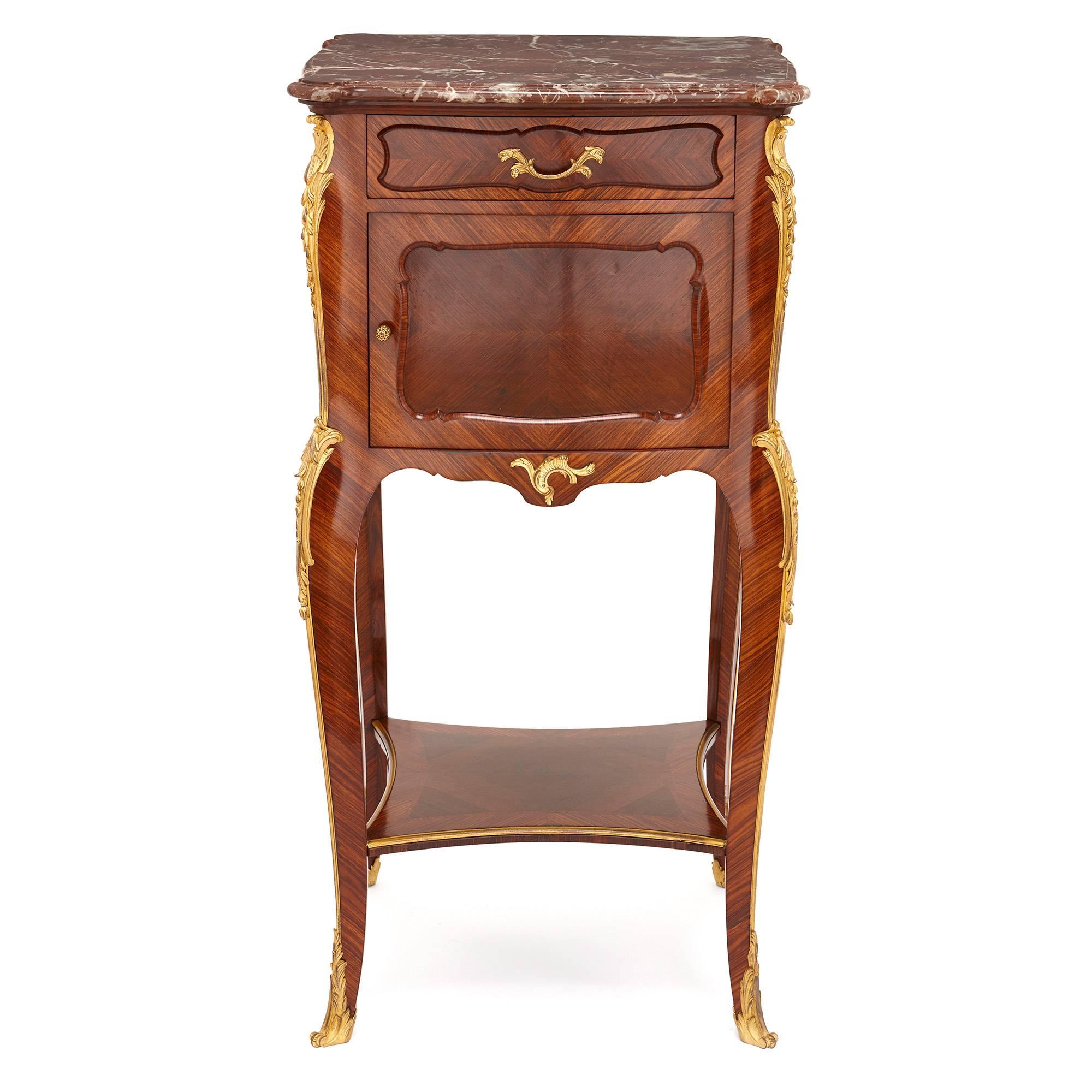 Possibly the greatest craftsman of the late 19th and early 20th century, French cabinetmaker Francois Linke, is responsible for the design of this stunning side cabinet. 

Inspired by the 18th century Rococo style, the cabinet is beautifully