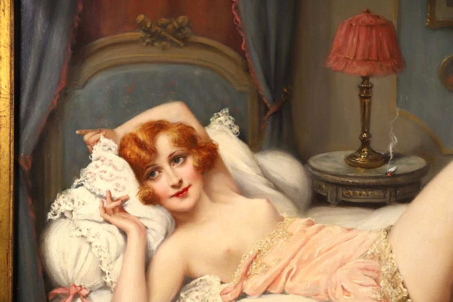An exceptional oil on original canvas circa 1910 by French genre painter Francois Martin-Kavel depicting a beautiful red-headed woman laying partially nude on a bed as a cigarette burns on the nightstand beside her.

Signature:
Signed lower