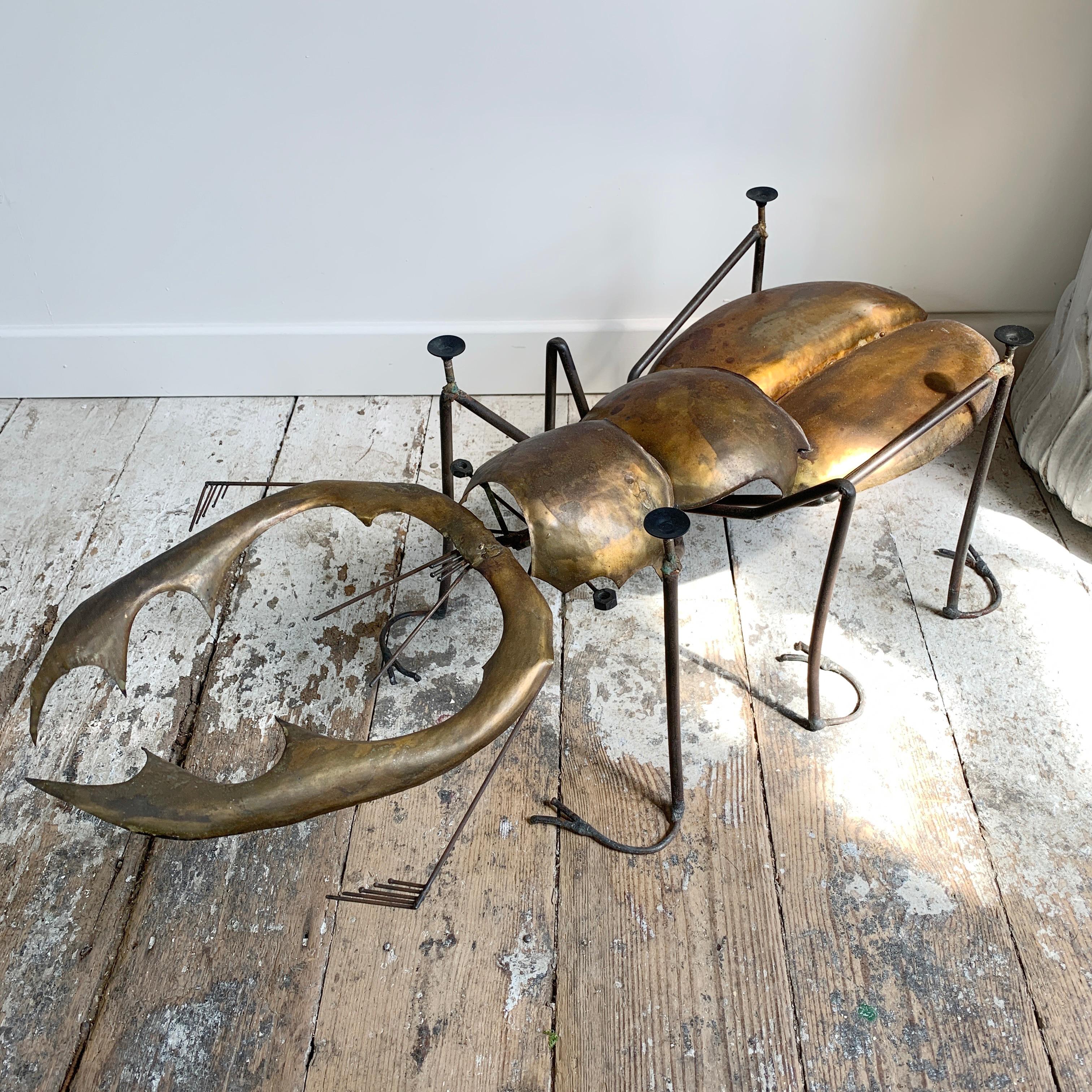 An exceptional brass and steel Stag Beetle table created and signed by the renowned French Sculptor and Artist, Francois Melin in the 1970s'. The table has been hand crafted by Melin using individual pieces of brass, shaped to form the various