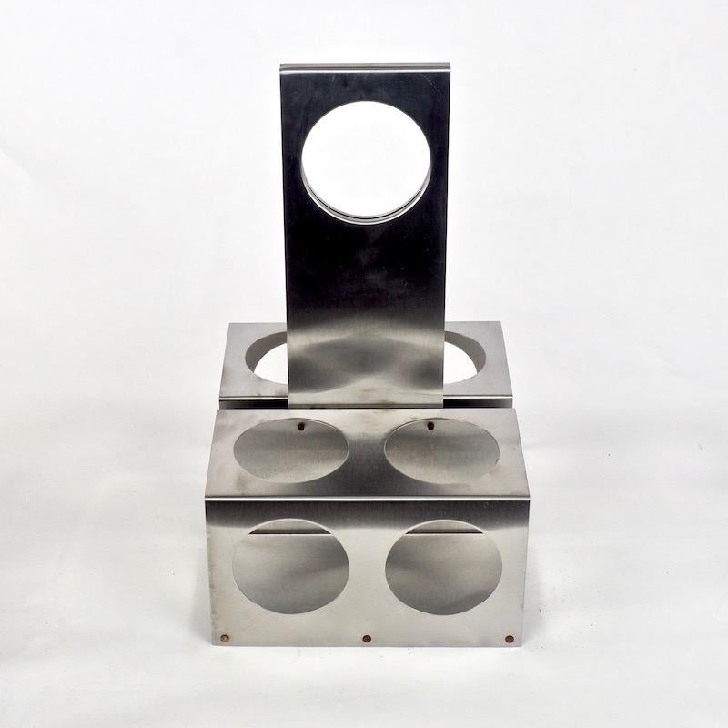 Minimalist brushed steel bottle holder or wine carrier designed by Francois Monnet (b. 1946) for Kappa of Paris in the 1970s.

Monnet founded Kappa after working under his own name and specialized in working with steel in association with