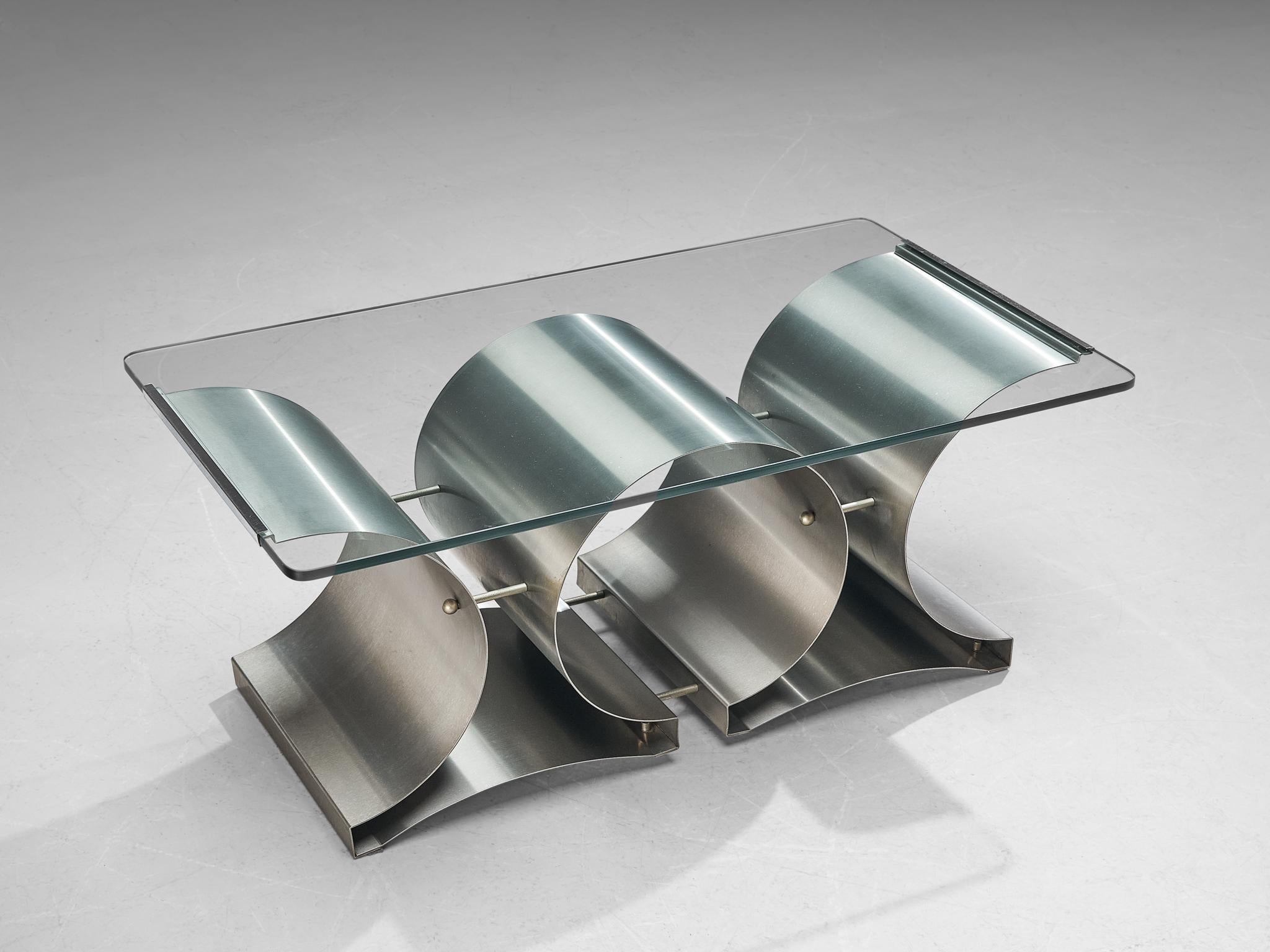 François Monnet coffee table, stainless steel, glass, France, 1970s

A chic X-base stainless steel coffee table by François Monnet, 1970s. The base of this coffee table is formed by two X shaped pieces of steel. They are pierced together with the