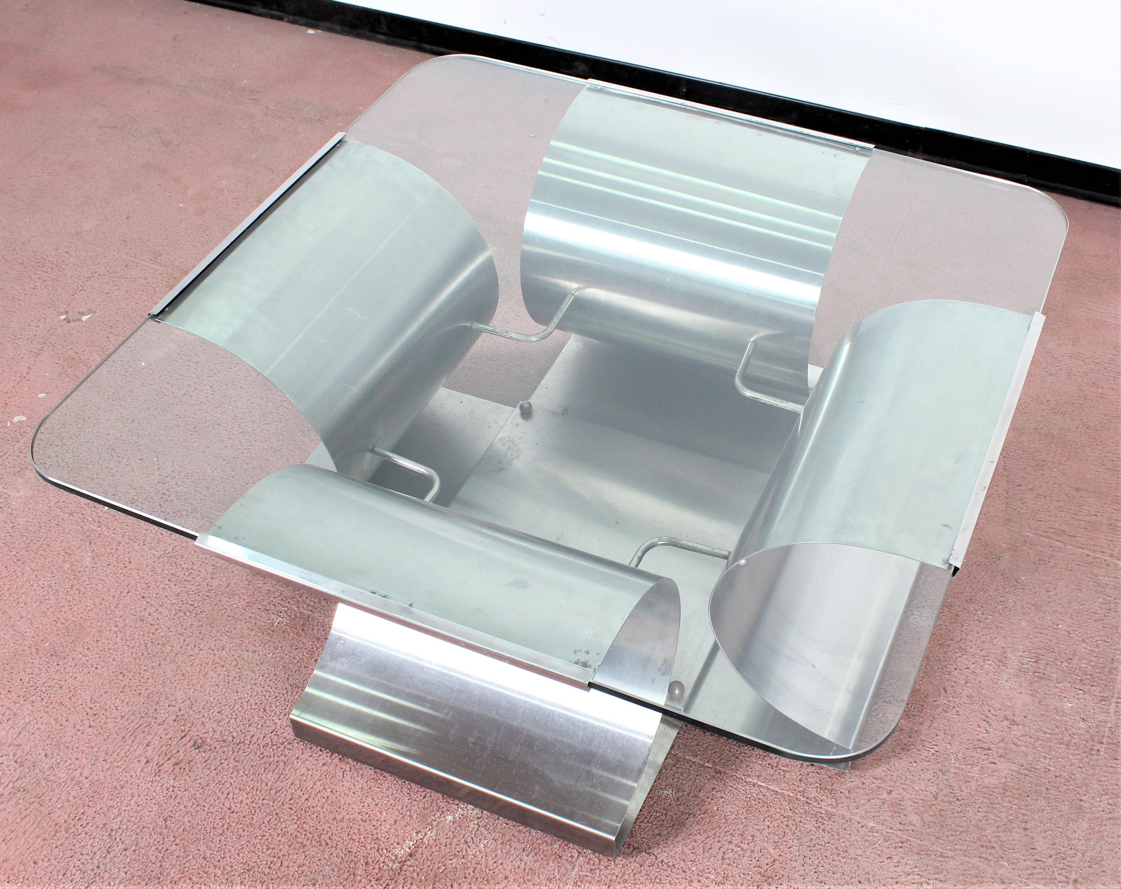 Beautifull Square brushed steel coffee table with glass top designed by François Monnet for Kappa. Manufactured in the 1970s.
Wear consistent with age and use.