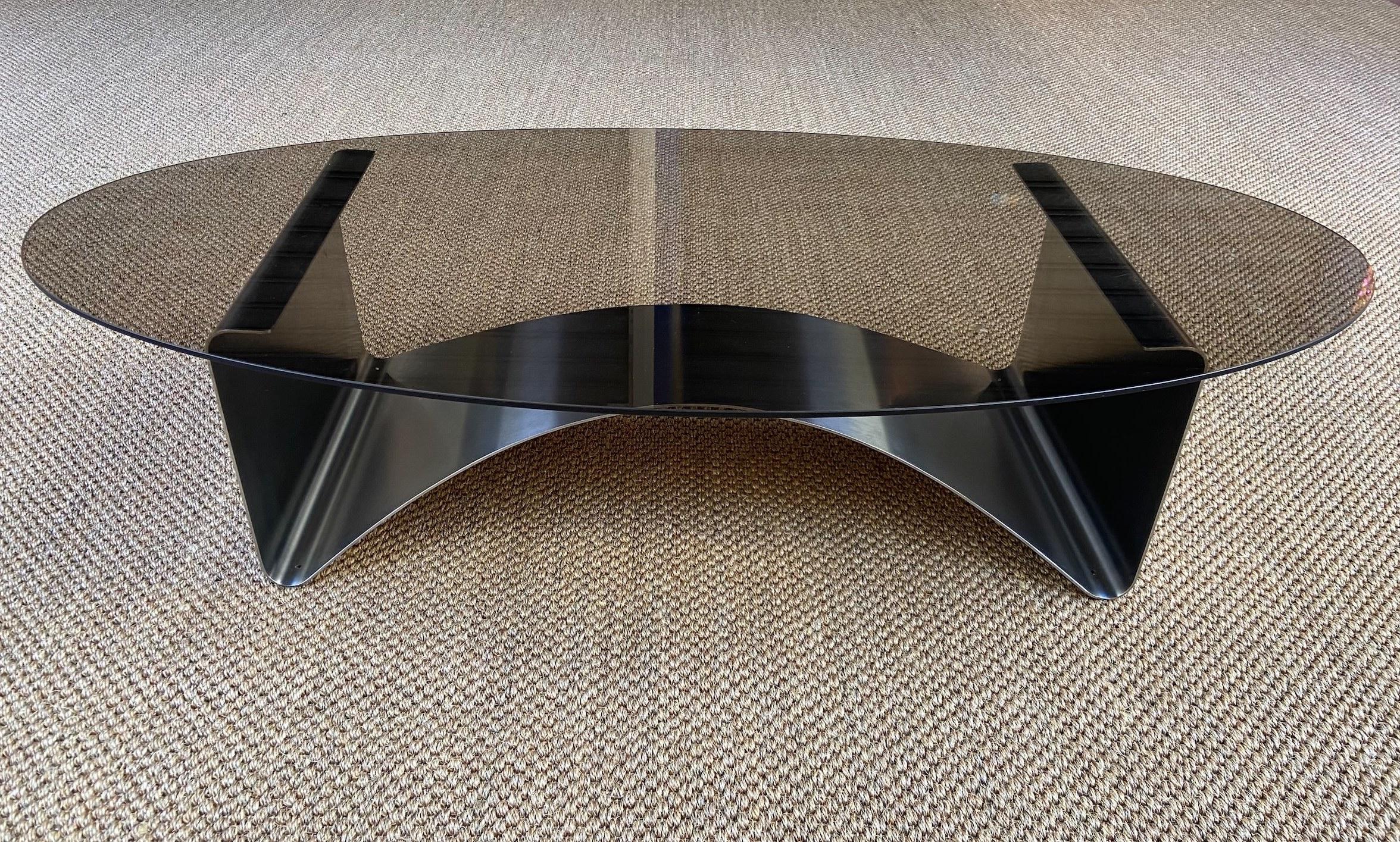 Francois Monnet - oval coffee table
1975
Smoked Glass and steel
Measures: H 28 x L 125 x P 60 cm.

 