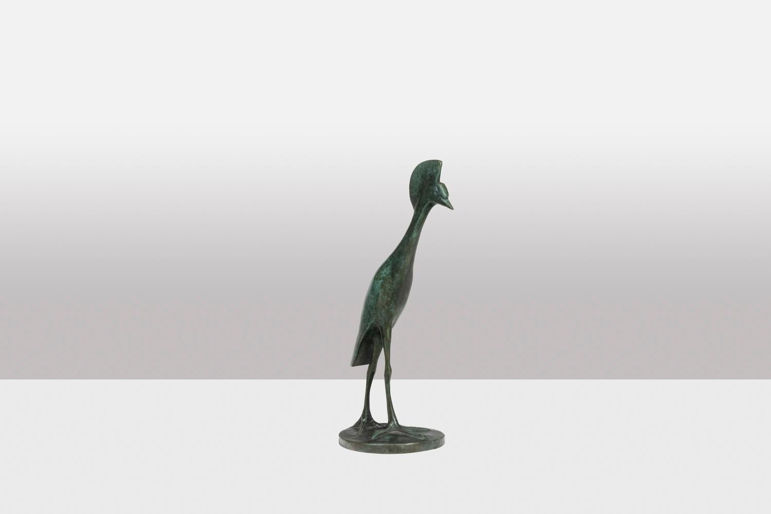 François Pompon.
Atelier Valsuani, edited by.

Sculpture entitled “Grue Couronnée en marche”. Bronze with green patina, lost wax casting.

Stamp of the Foundry “cire perdue C. Valsuani”, on the terrace. Reproduction dated 2006. Numbered