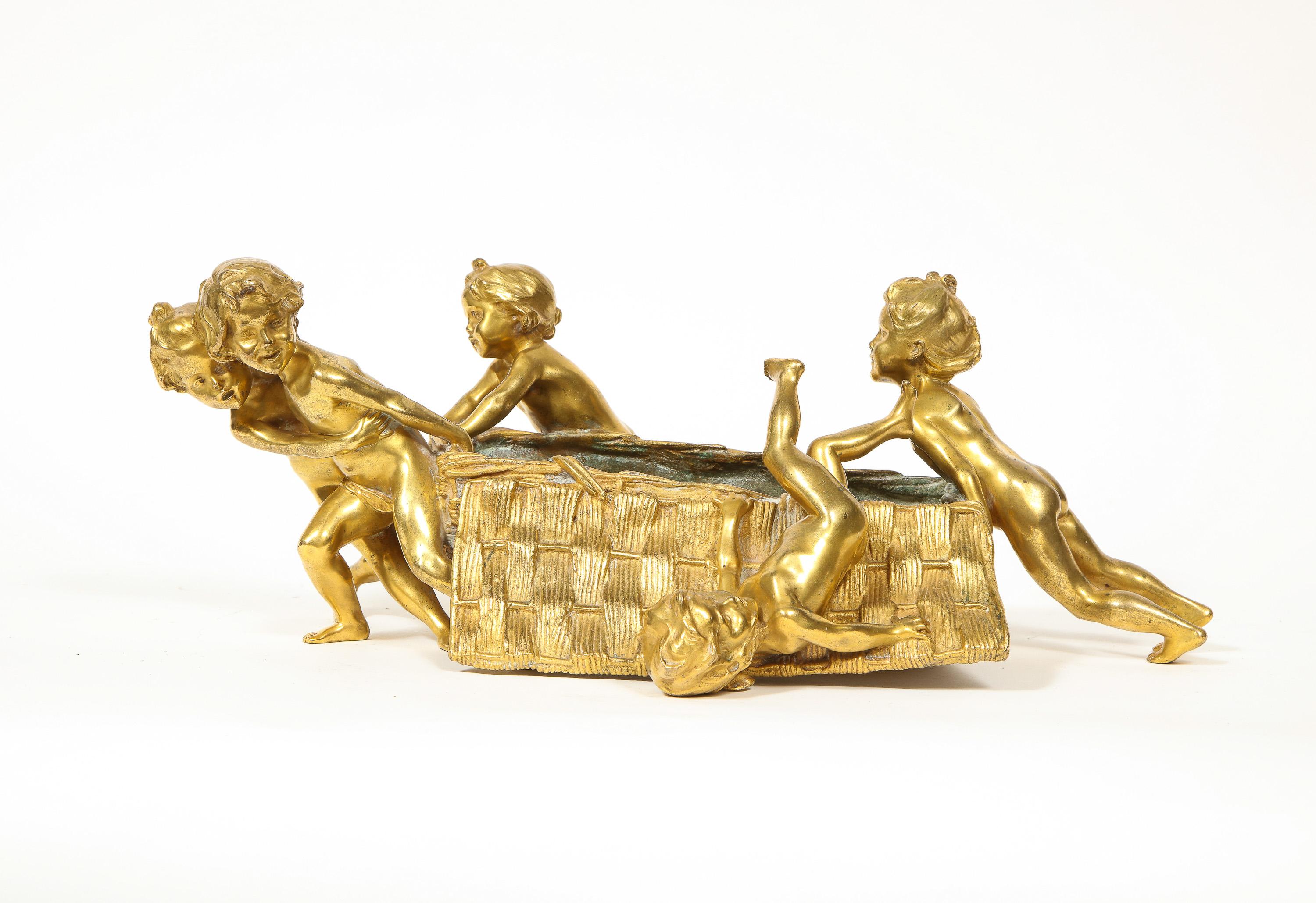 Francois-Raoul Larche (French, 1860-1912) A French gilt bronze ormolu figural table centerpiece or basket, circa 1900.

Depicting baby children pushing and pulling the basket.

Inscribed Raoul Larche Siot-Paris foundry marked edition number