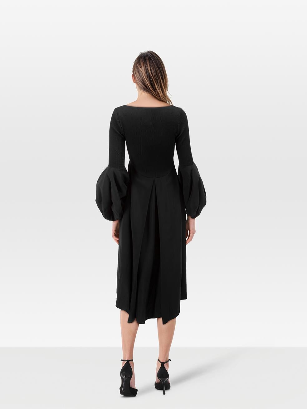 CONDITION is Very Good. Hardly any visible wear to the dress is evident on this used Francoise designer resale item.
 
 Details
 
 
 Black
 
 Synthetic
 
 Dress
 
 Midi
 
 Round neck
 
 Long sleeves
 
 Bell sleeves detail
 
 Elasticated
 
 Side zip