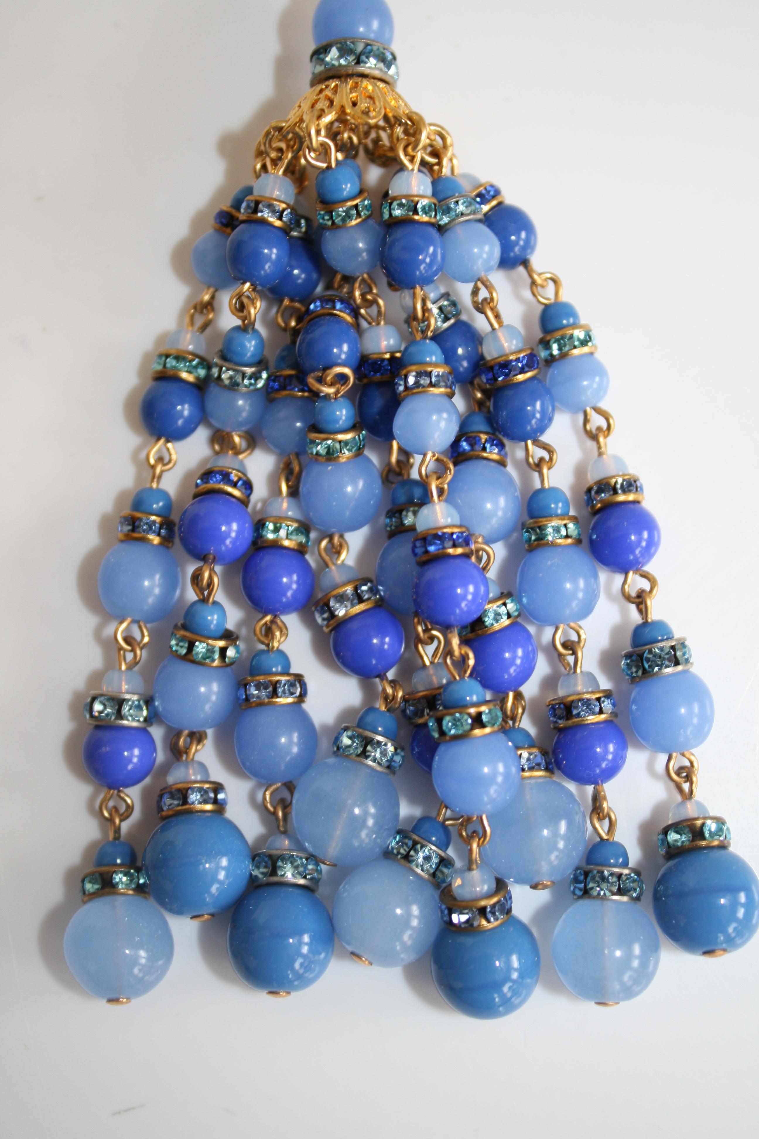 Long tassel necklace with glass and crystal beads in shades of blue from Francoise Montague. 