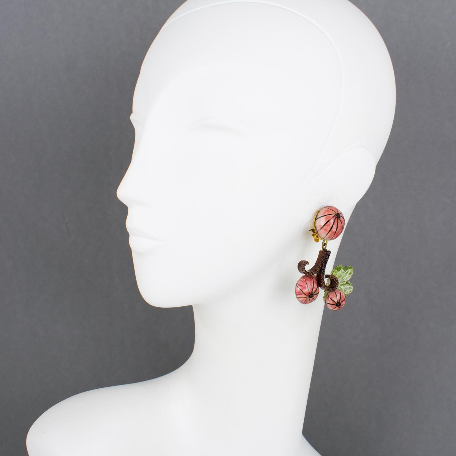 These charming resin clip-on earrings were designed by Cilea Paris for French jewelry designer Francoise Montague. They feature a Japanese floral inspiration with a dangling shape, all carved and textured, in dusty pink, cocoa brown, and translucent