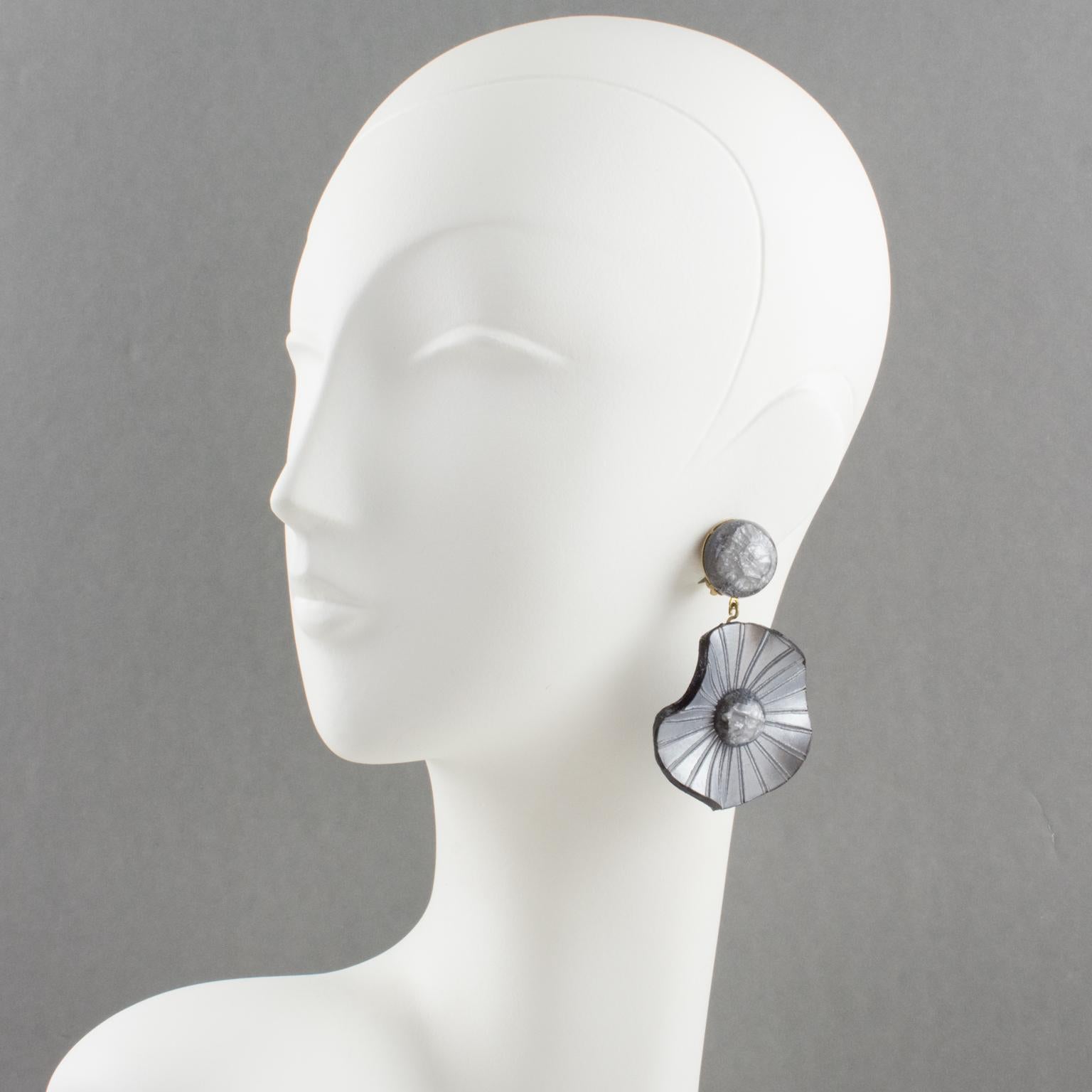 These exquisite French designer Francoise Montague resin clip-on earrings were created by Cilea Paris. They feature a unique dangling shape, all carved, textured, and waved floral disks in pearlized gray color and transparent half beads with