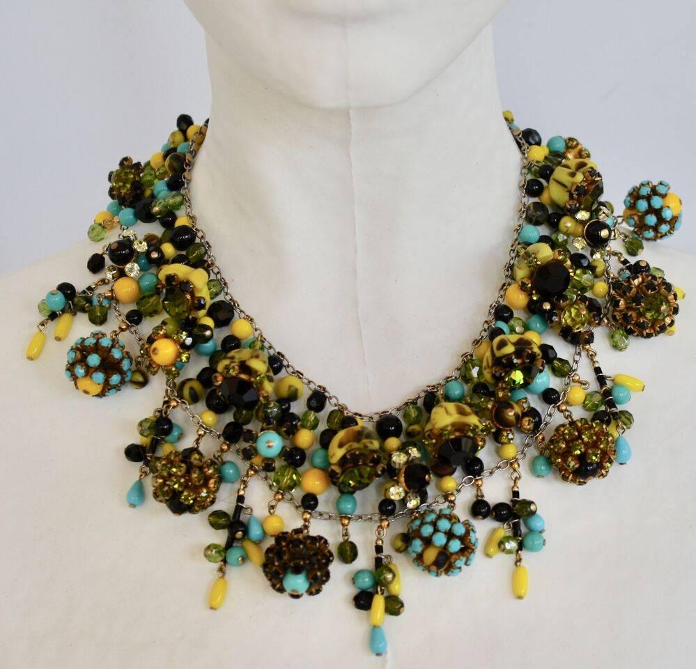 A famous style from Francoise Montague. Hand beaded collar necklace in a fresh mix of yellow and turquoise glass beads with Swarovski crystal details. 

15