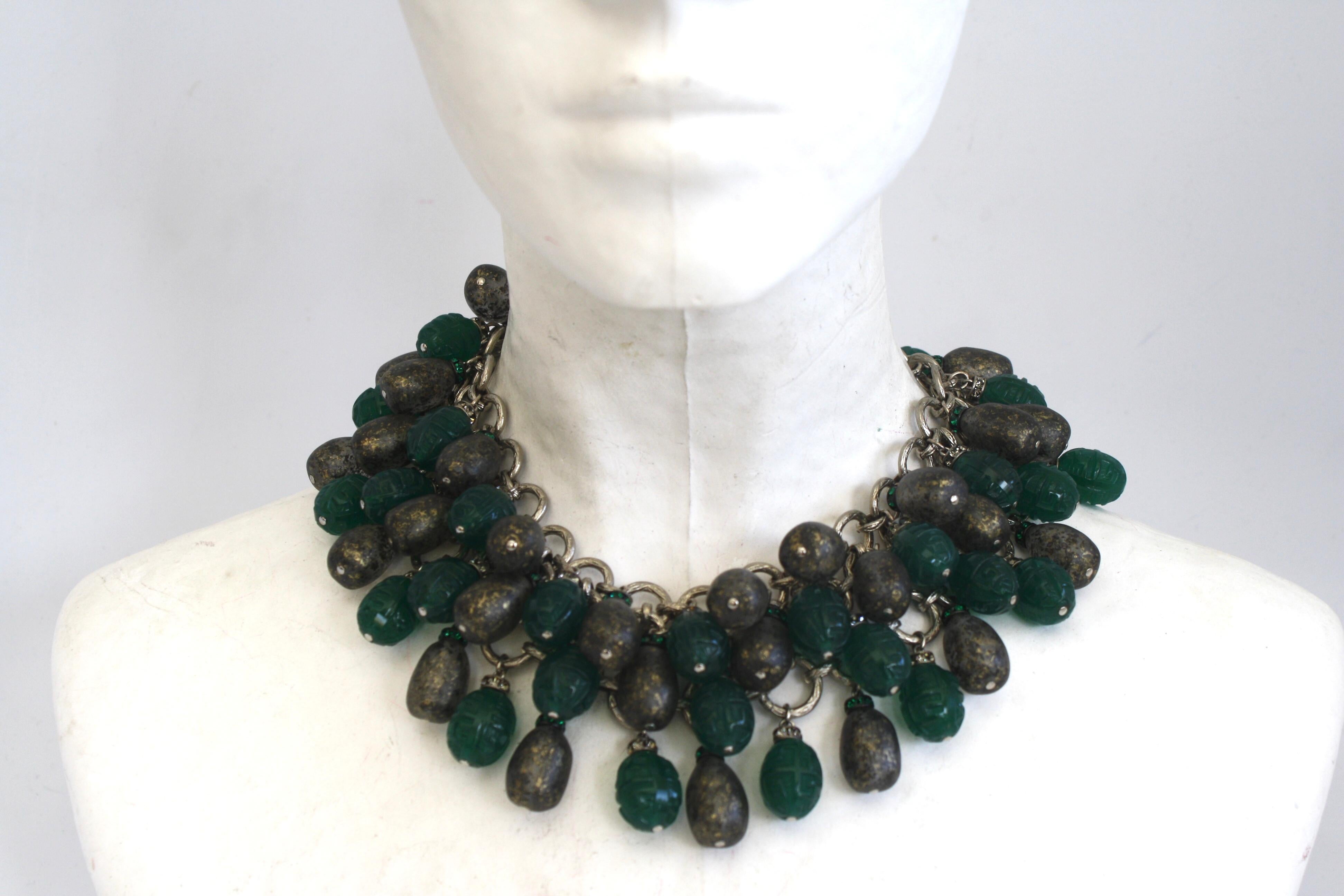 Multi layer glass cabochons come together on dark rhodium to make this gorgeous statement piece from Francoise Montague. 