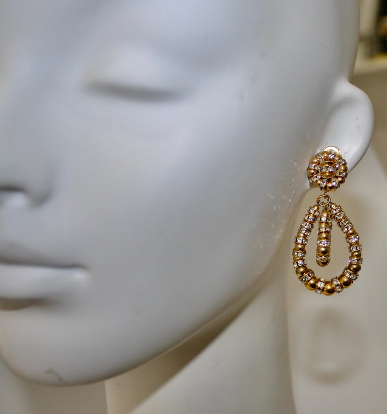 The iconic earring style from Francoise Montague in gold  and Swarovski crystals. These clip earrings dance as you move and are universally flattering. A must have addition to any collection. 