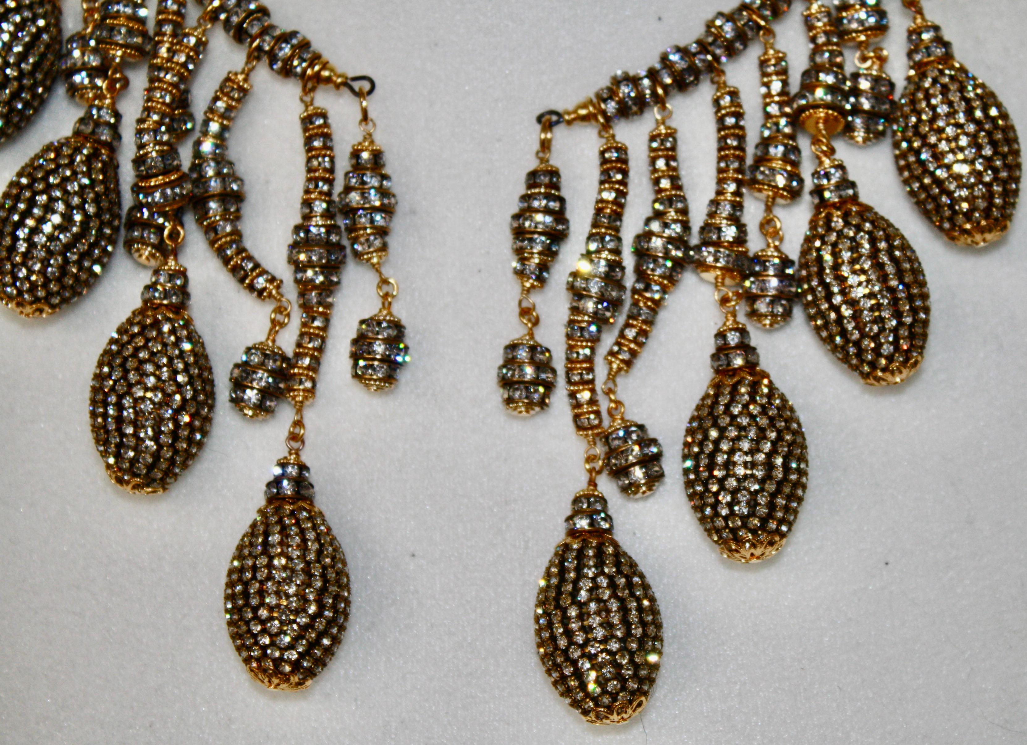 A wraparound Swarovski Crystal rondelle  Choker with 16 different drop .
Necklace is adjustable. Drops are 1.5” to 4” long