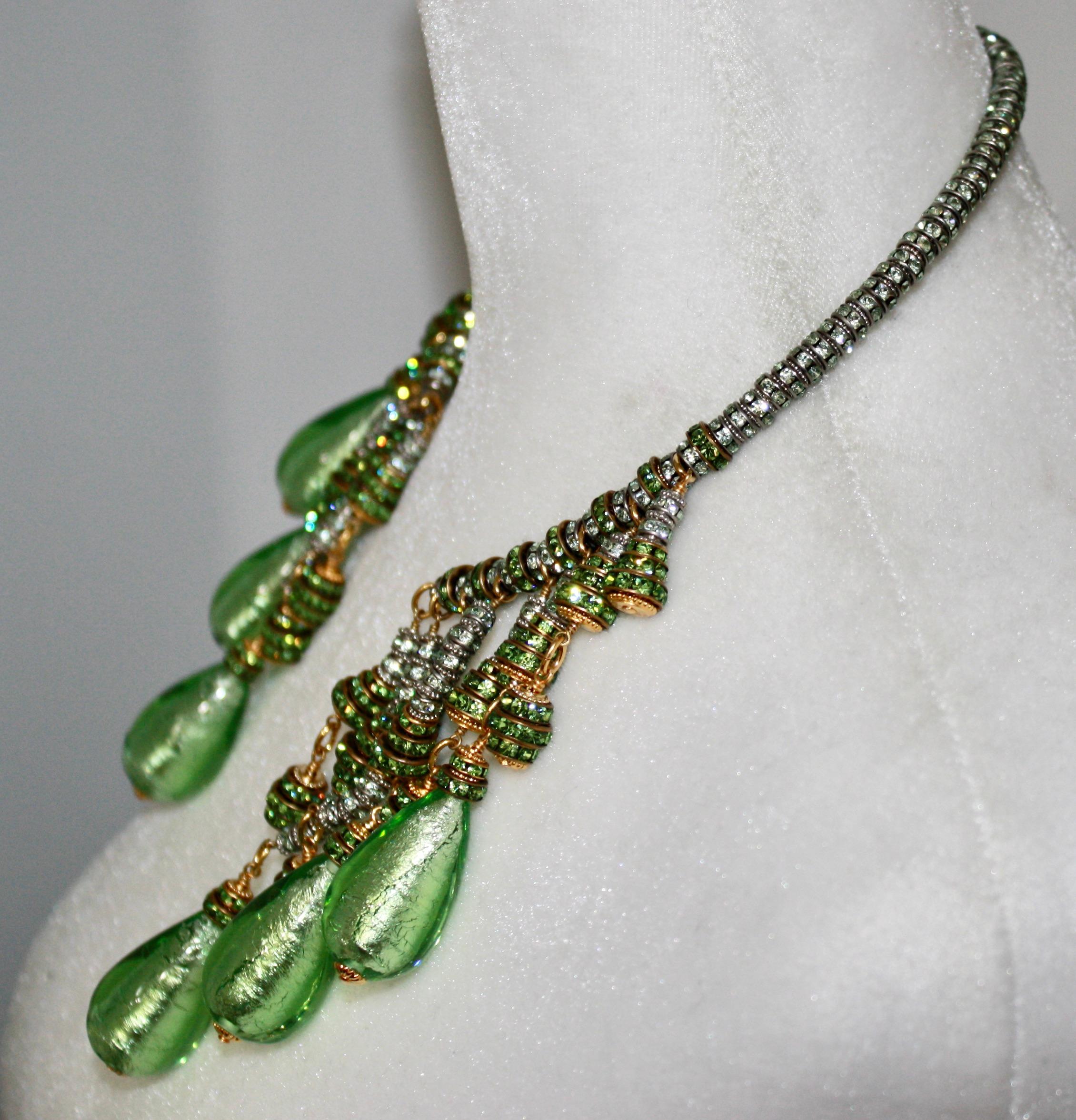 A wraparound Swarovski Crystal rondelle choker in green with drops and 6 unique bright green  Murano pear shape drop.
One of a kind.
Drops are 2”x1.5”