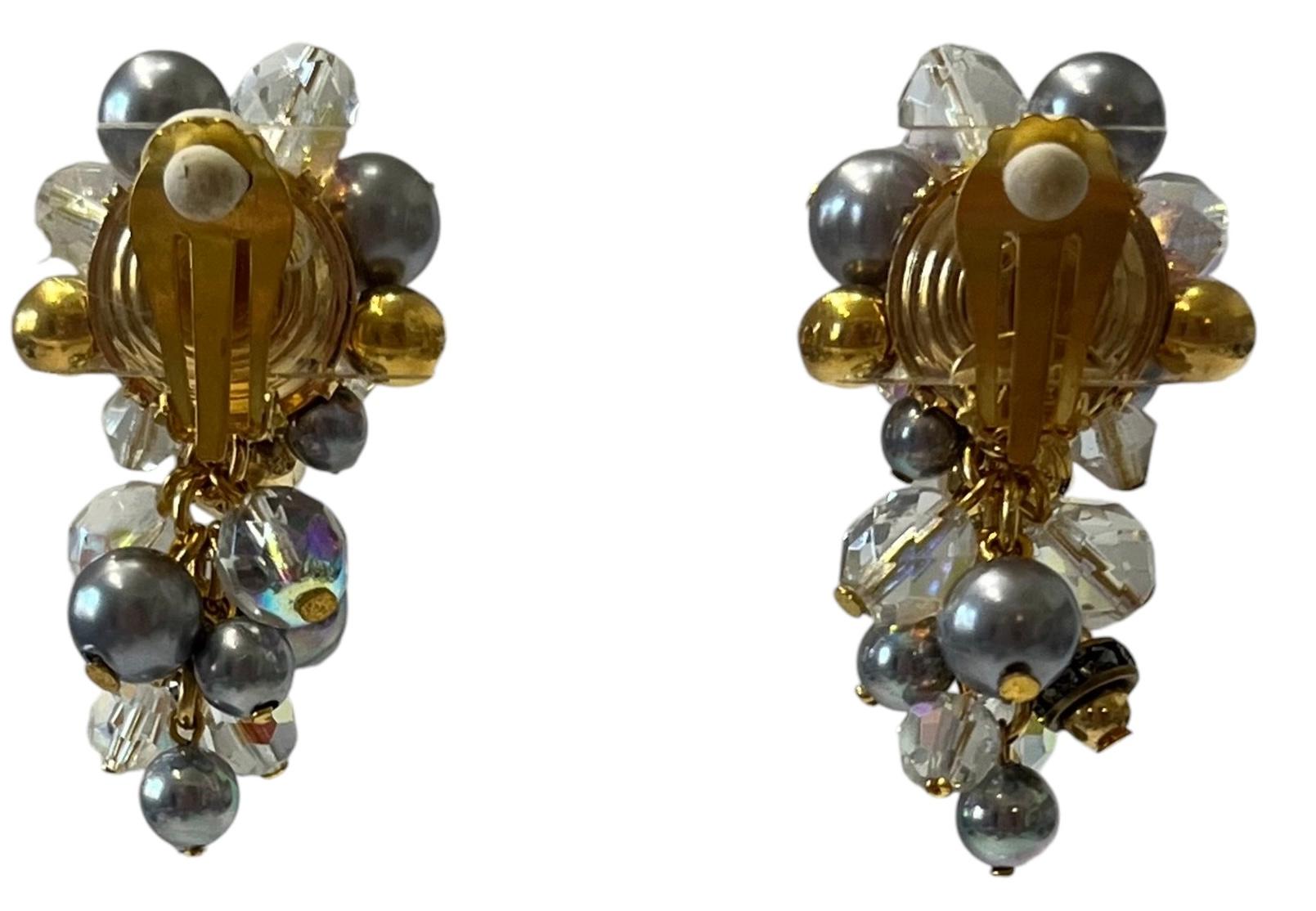 Grey, clear and gold glass beads clip earrings inspired after a bunch of grapes from French design house Francoise Montague. 
Francoise Montague took over the De Saurma jewelry workshop in the late 1940s. Her mother founded the workshop in 1945,