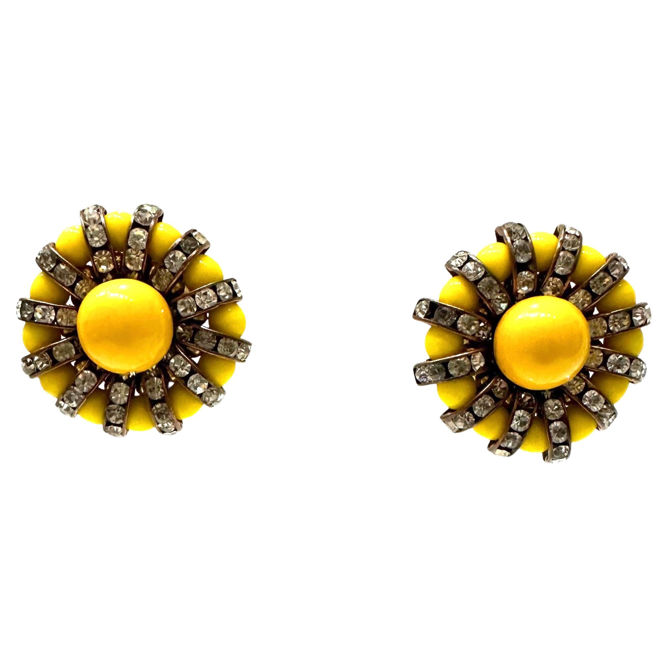 Handmade glass cabochons and Swarovski crystal rondelles on gold metal. 
Francoise Montague took over the De Saurma jewelry workshop in the late 1940s. Her mother founded the workshop in 1945, according to 