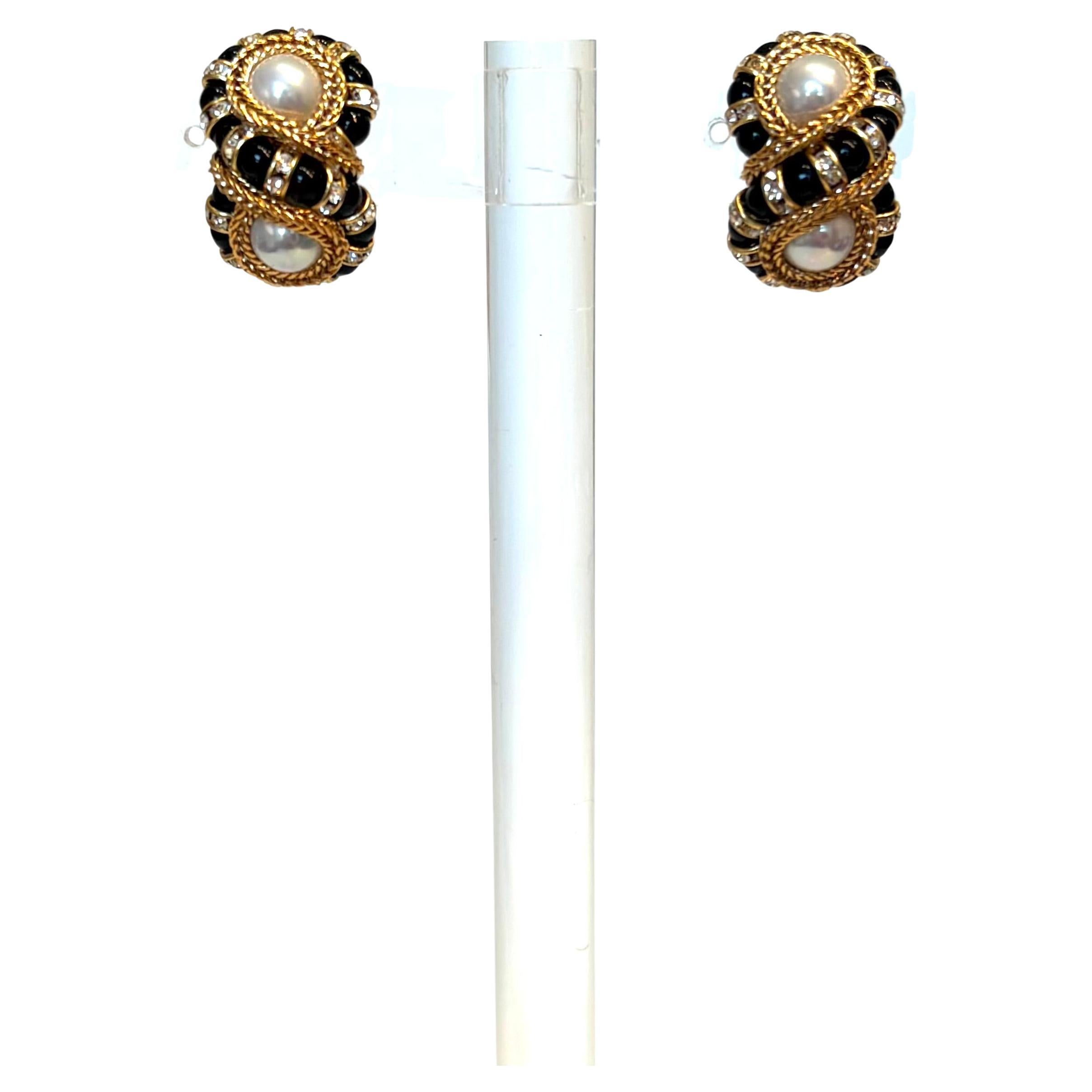 The iconic earring style from Francoise Montague in gold and turquoise handmade glass pearls is  universally flattering. A must have addition to any collection.  
The Legacy  Our story began in 1935 with a small jewelry workshop founded by Françoise