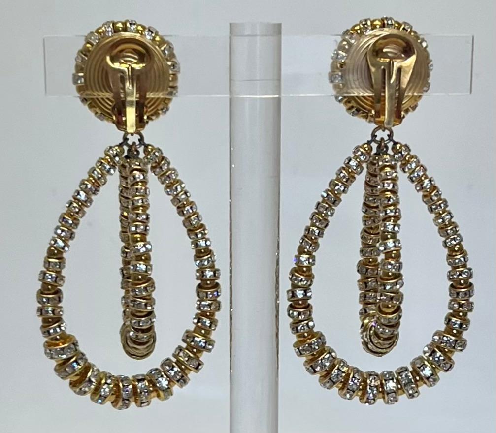 Iconic earring style from famed jewelry design house Francoise Montague. Made with glass pearl vintage beads and Swarovski Crystal rondelles on gold.

Francoise Montague took over the De Saurma jewelry workshop in the late 1940s. Her mother founded