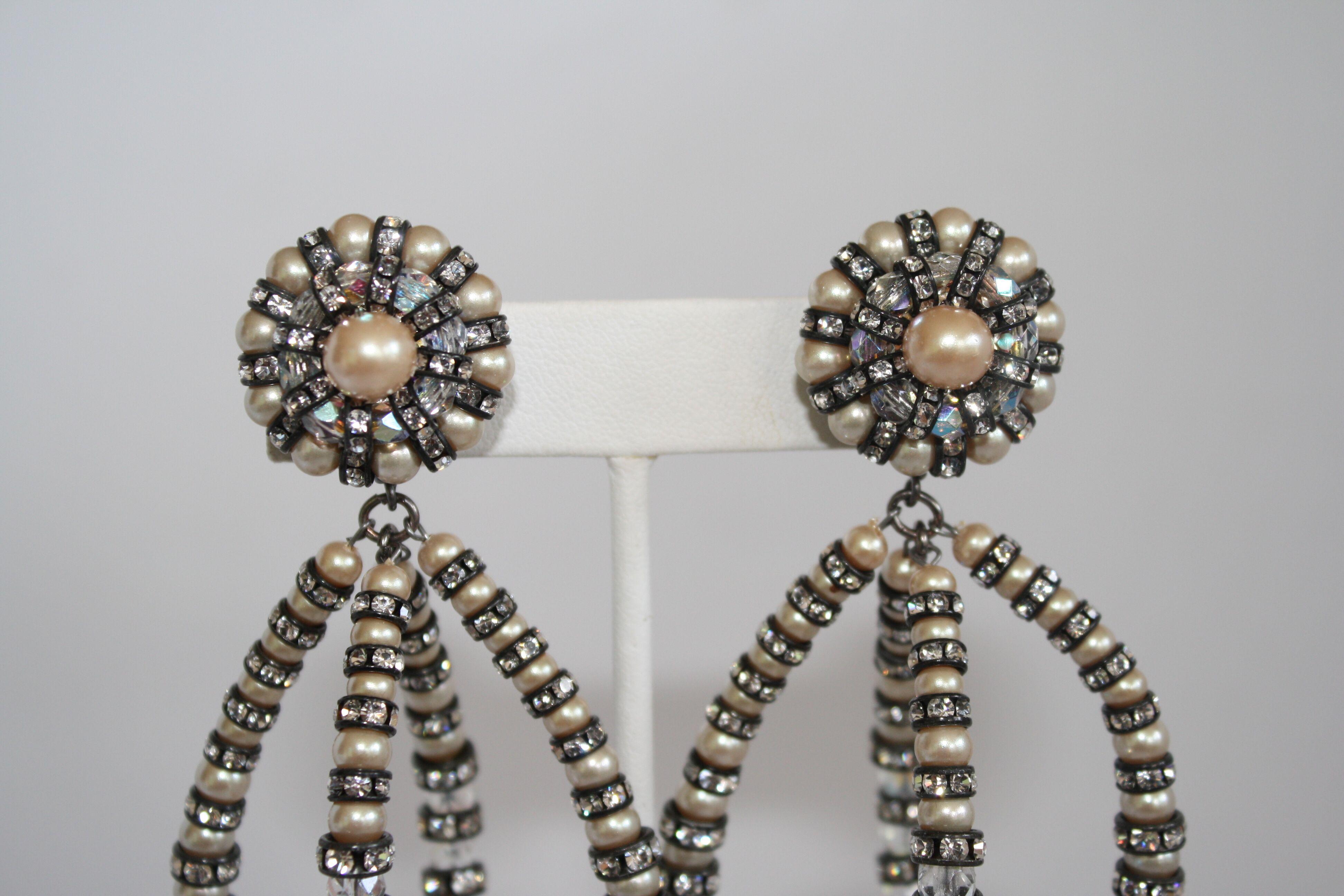 Iconic earring style from famed jewelry design house Francoise Montague. Made with glass pearl vintage beads and Swarovski Crystal rondelles on black metal.
