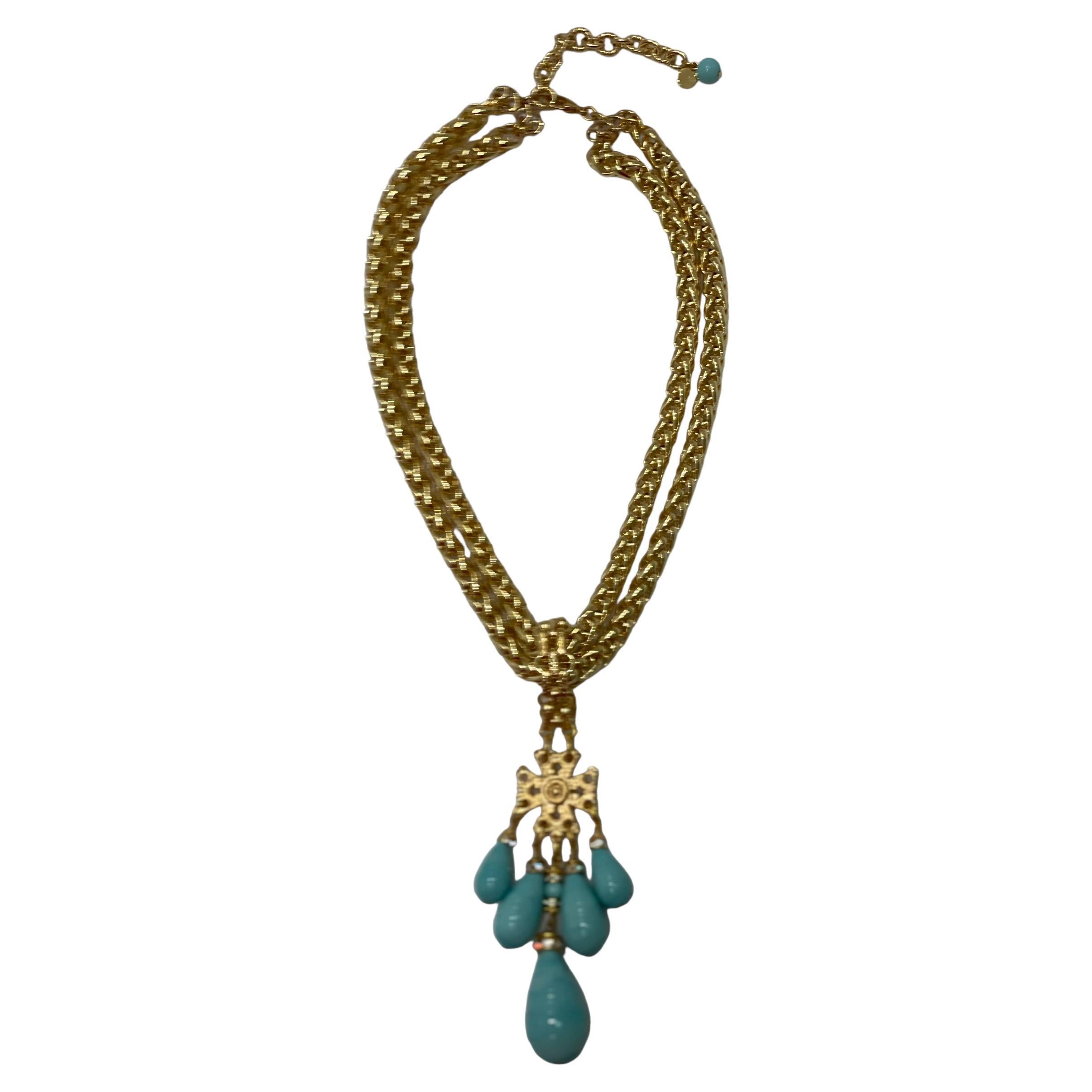 Brass plated gold chain with removable pendant . 5 pate de verre drops set with Swarovski Crystal rondelles. Pendant is 5” long. Extension chain is 3 “ and stamp with Francoise Montague signature 
Francoise Montague took over the De Saurma jewelry