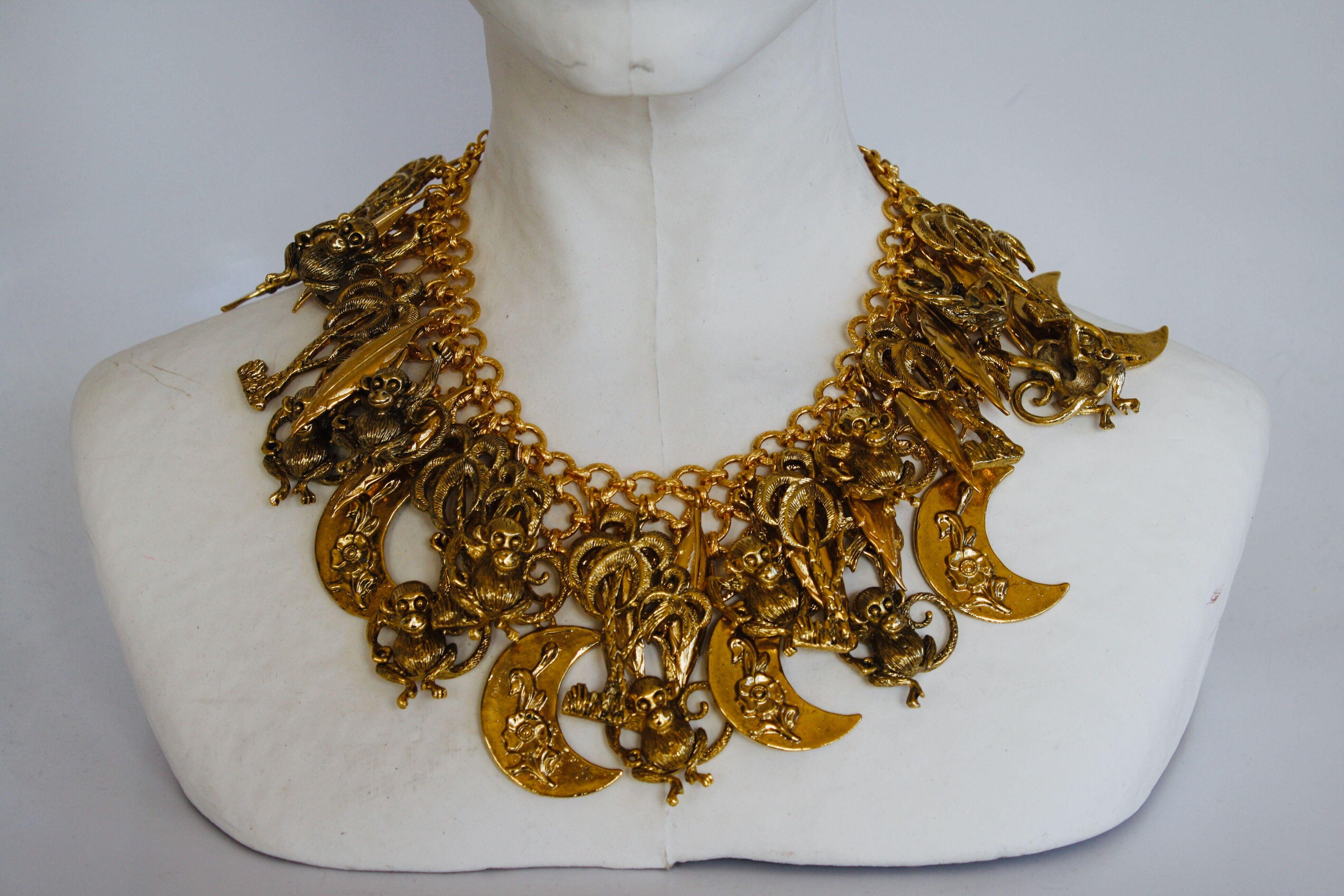 Celestial themed charm necklace in gilded brass from French design house Francoise Montague. 