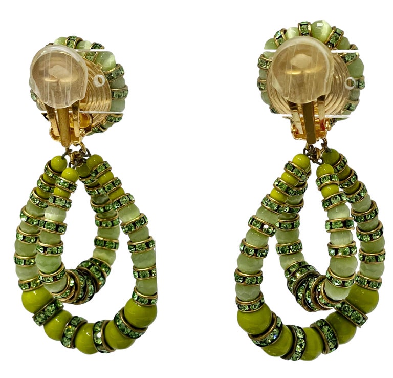 This an iconic style from designer Francoise Montague in an anise hue. 
Made with Swarovski Crystal rondelles and handmade glass beads. Theses are clip earrings.
Francoise Montague took over the De Saurma jewelry workshop in the late 1940s. Her