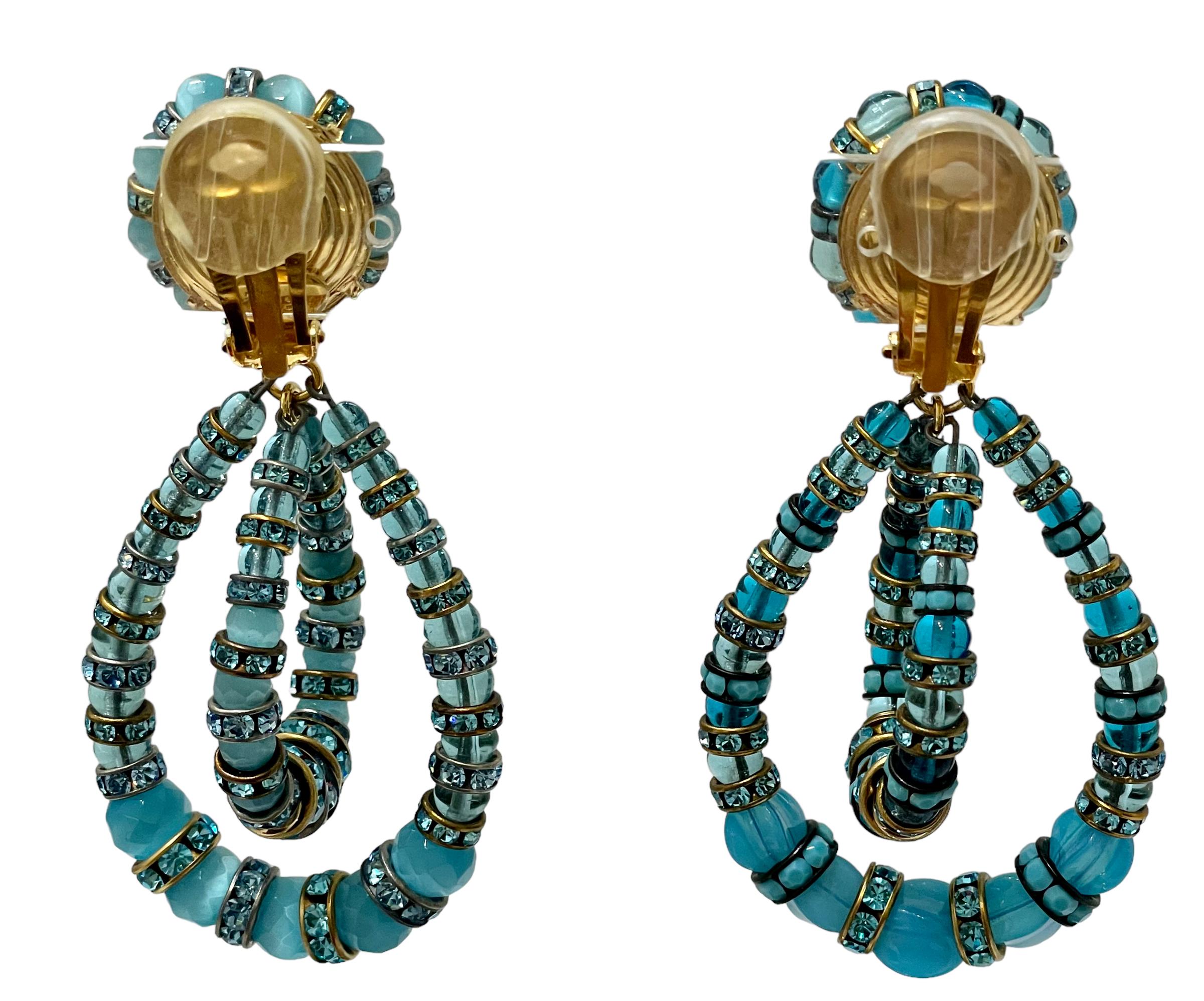 This an iconic style from designer Francoise in shades of aqua hue. 
Made with Swarovski Crystal rondelles and handmade glass beads. These are clip earrings.
Francoise Montague took over the De Saurma jewelry workshop in the late 1940s. Her mother