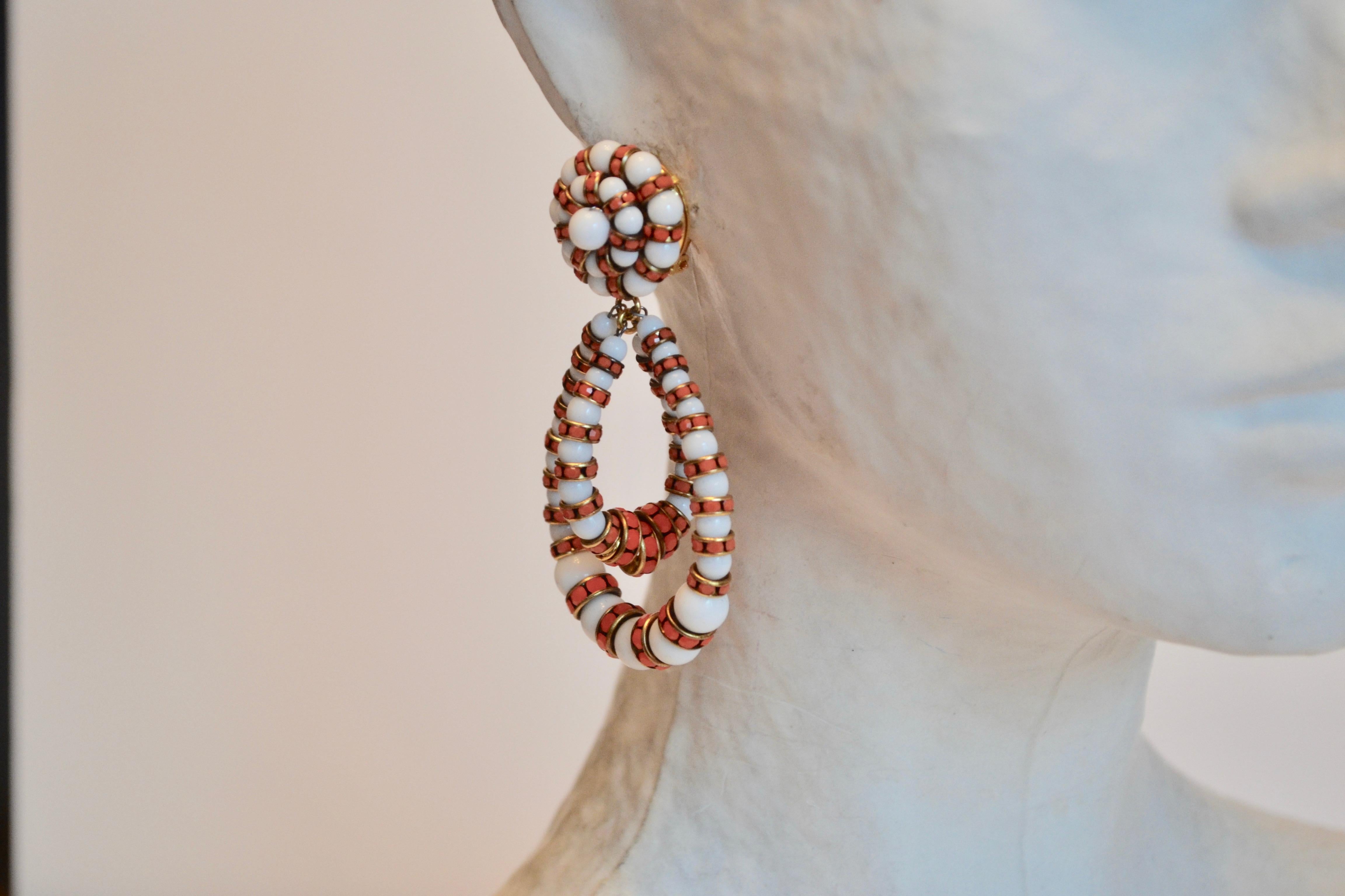 Orange and coral medium sized clip earrings in the classic Lolita shape from Francoise Montague. 