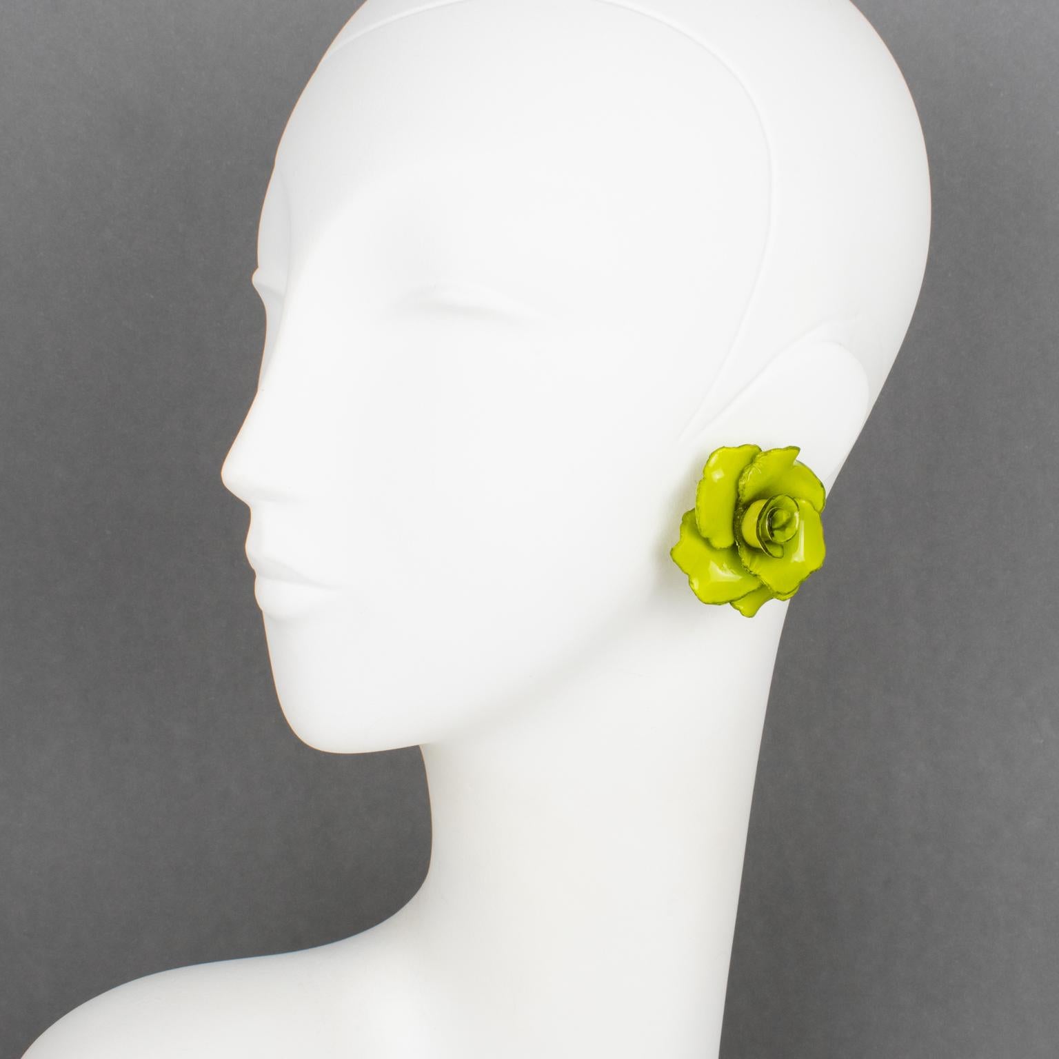 Cilea Paris designed these romantic clip-on earrings for French jewelry designer Francoise Montague. The dimensional resin shape features rose flowers in elegant avocado-green colors. There is no visible signature like all the vintage Francoise