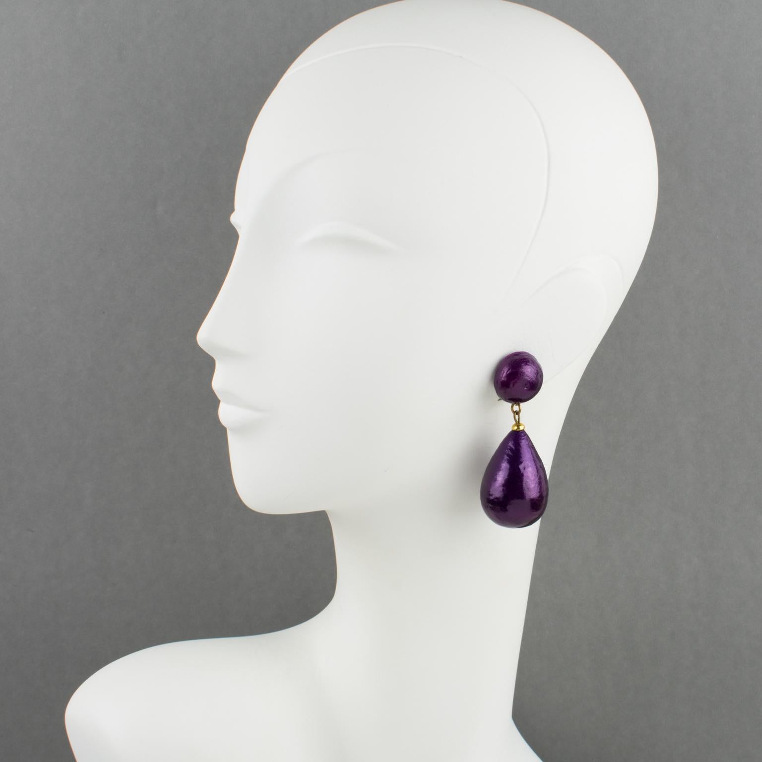 Elegant Francoise Montague Paris resin clip-on earrings. The dangle shape features a resin teardrop bead with a papier-mache-textured pattern in intense pearlized purple color. There is no visible signature like all the vintage Francoise Montague