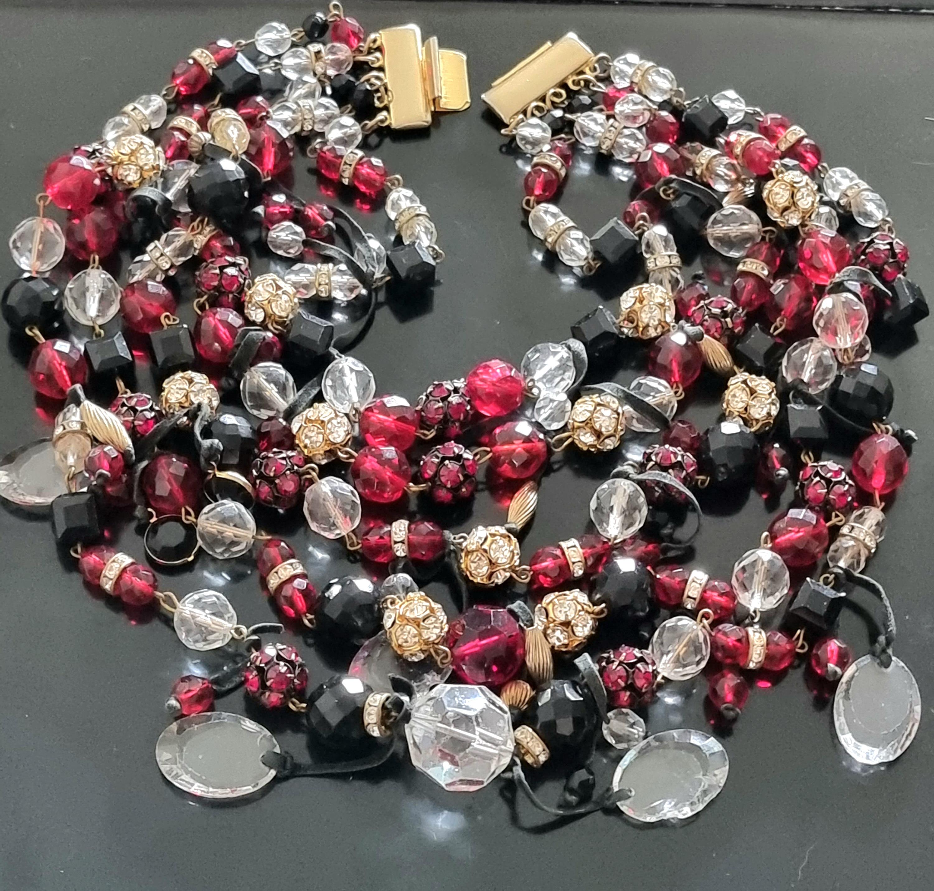 Magnificent old massive NECKLACE,
60s vintage,
glass beads, rhinestones,
exceptional quality work,
by FRANÇOISE MONTAGUE,
length of the necklace (the smallest row) 38 cm, weight 323 g,
NECKLACE is in good condition, except for the transparent oval