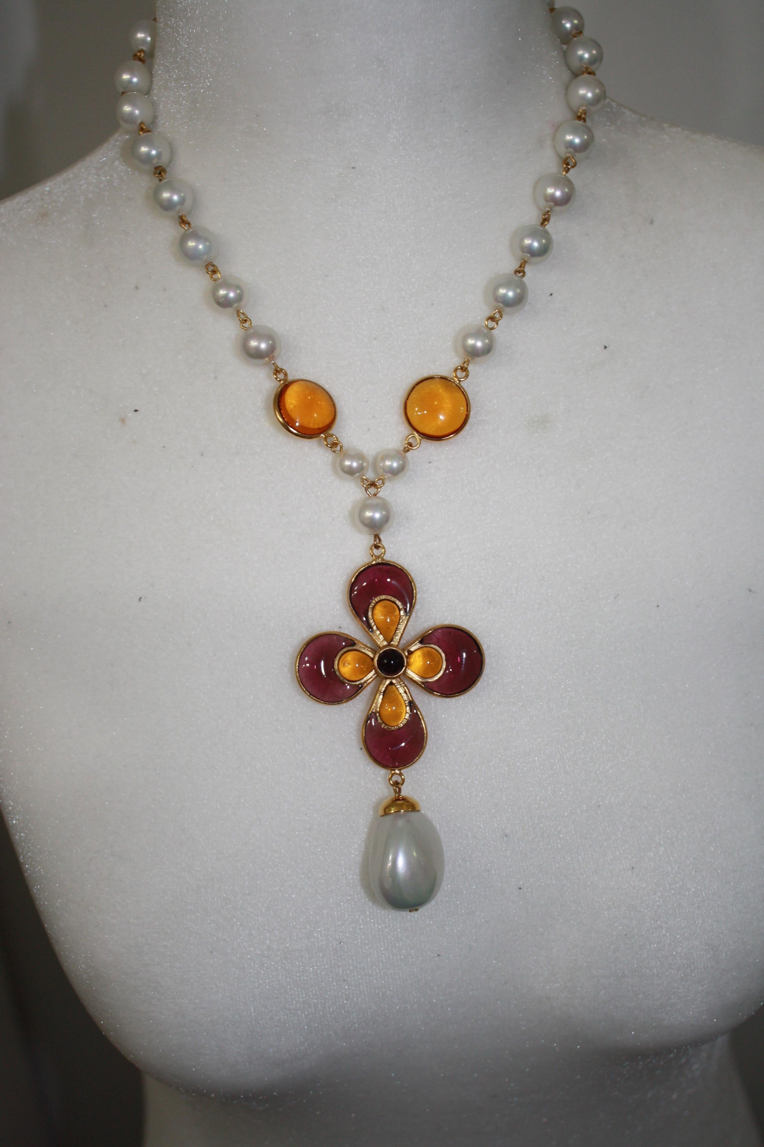 Handmade glass pearls and Gripoix work pate de verre motif choker.
Flower motif is 2”.
Looks great layered with Francoise Montague purple long necklace.