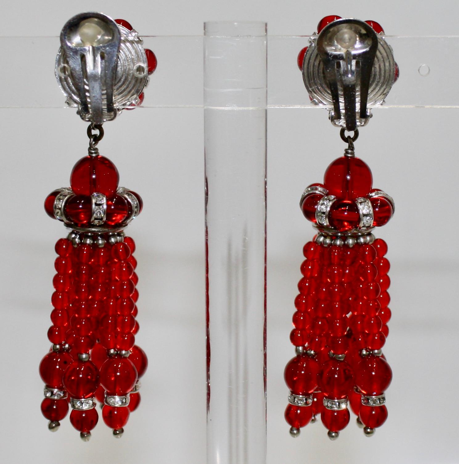 Clip earring . Handmade glass cabochons with silver finish Swarovski crystal rondelles.
A stunning statement earring.