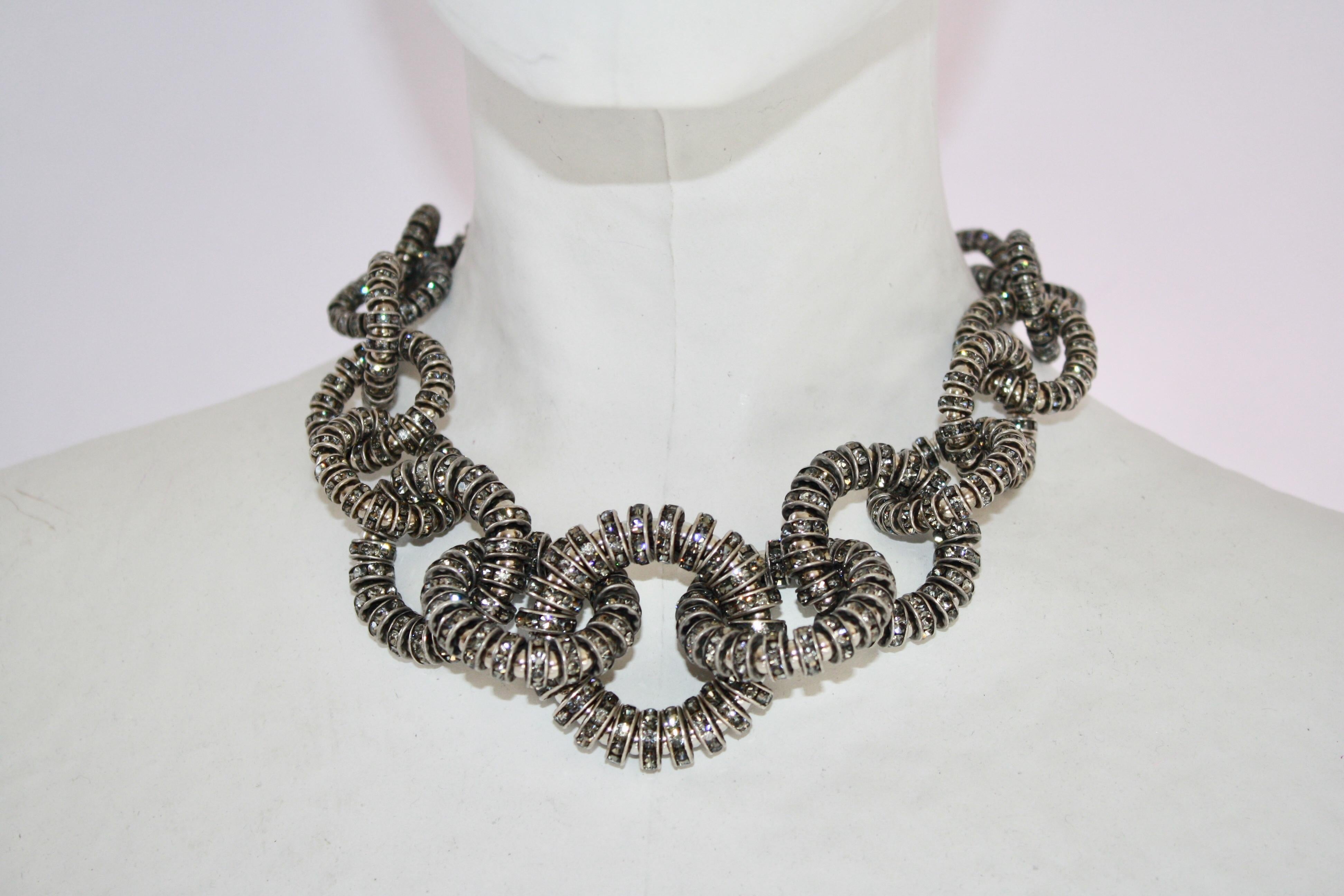 Choker necklace made with silver and Swarovski crystal rondelles from Francoise Montague. 

16” plus 3” extension 
Largest link is 1 3/4 “
Smallest link is 3/4”